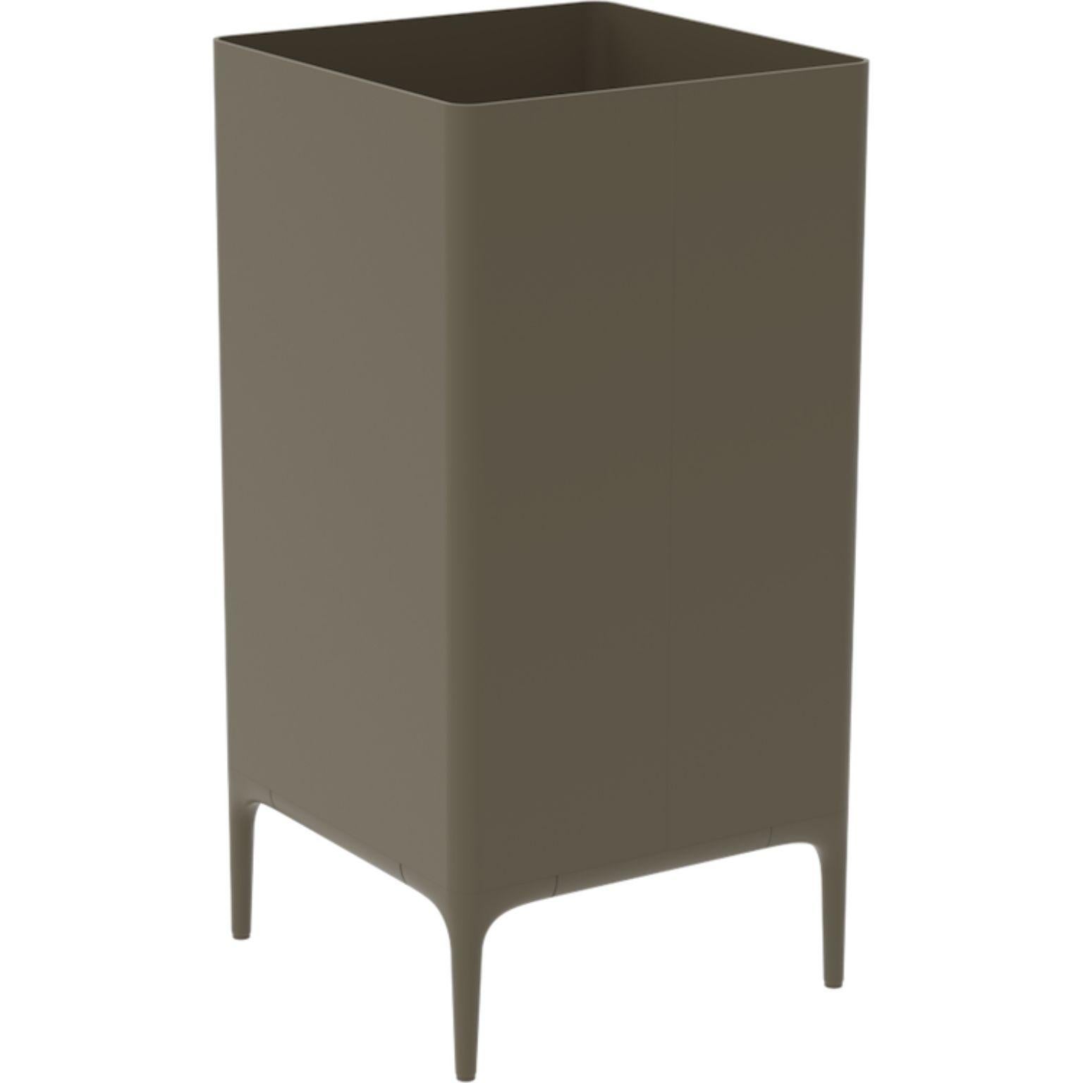 Xaloc Bronze 95 Pot by MOWEE
Dimensions: D45 x W45 x H90 cm
Material: Aluminium
Weight: 12 kg
Also Available in different colours and finishes. 

 Xaloc synthesizes the lines of interior furniture to extrapolate to the exterior, creating an