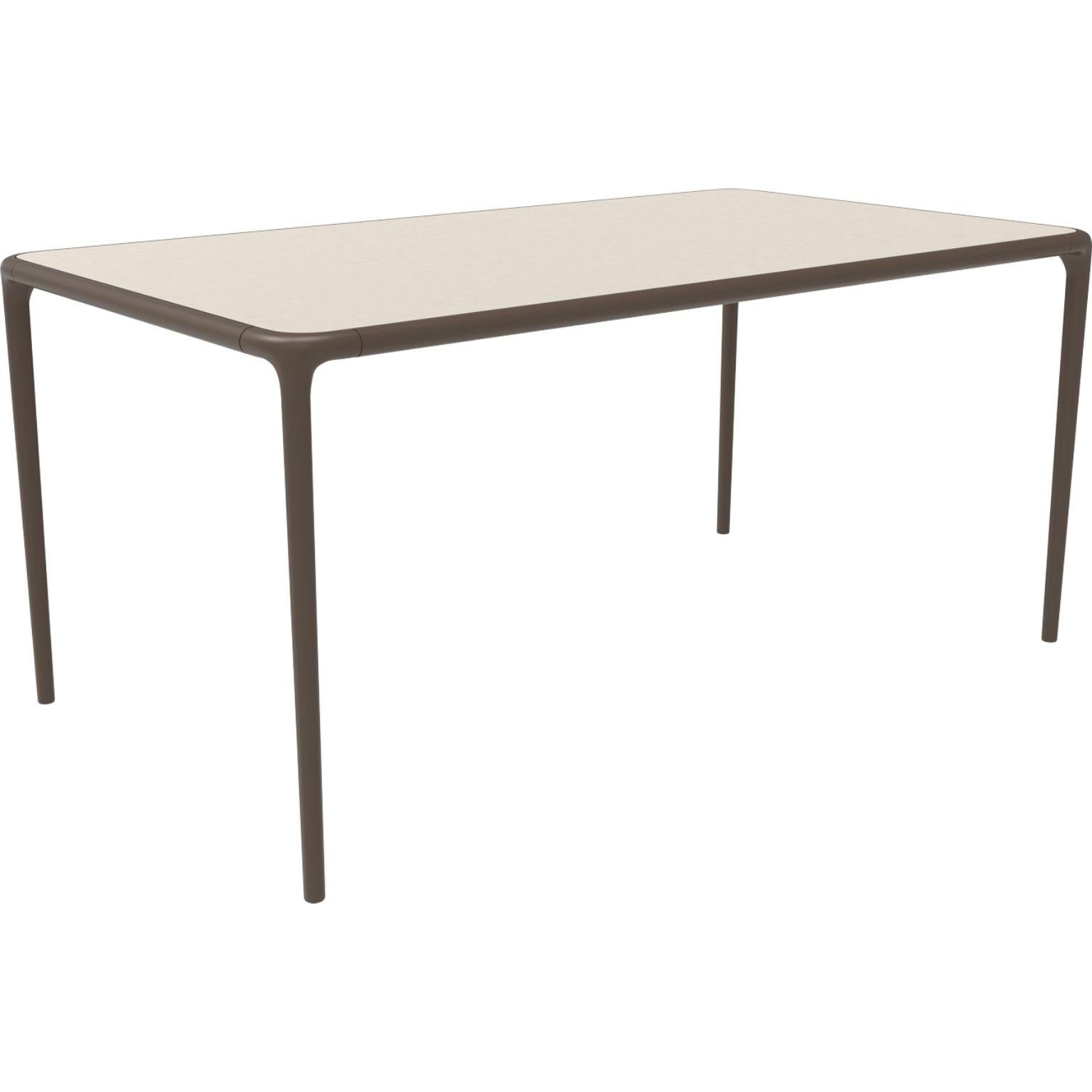 Xaloc bronze glass top table 160 by Mowee
Dimensions: D 160 x W 90 x H 74 cm
Material: Aluminum, tinted tempered glass top.
Also available in different aluminum colors and finishes (HPL Black Edge or Neolith).

Xaloc synthesizes the lines of
