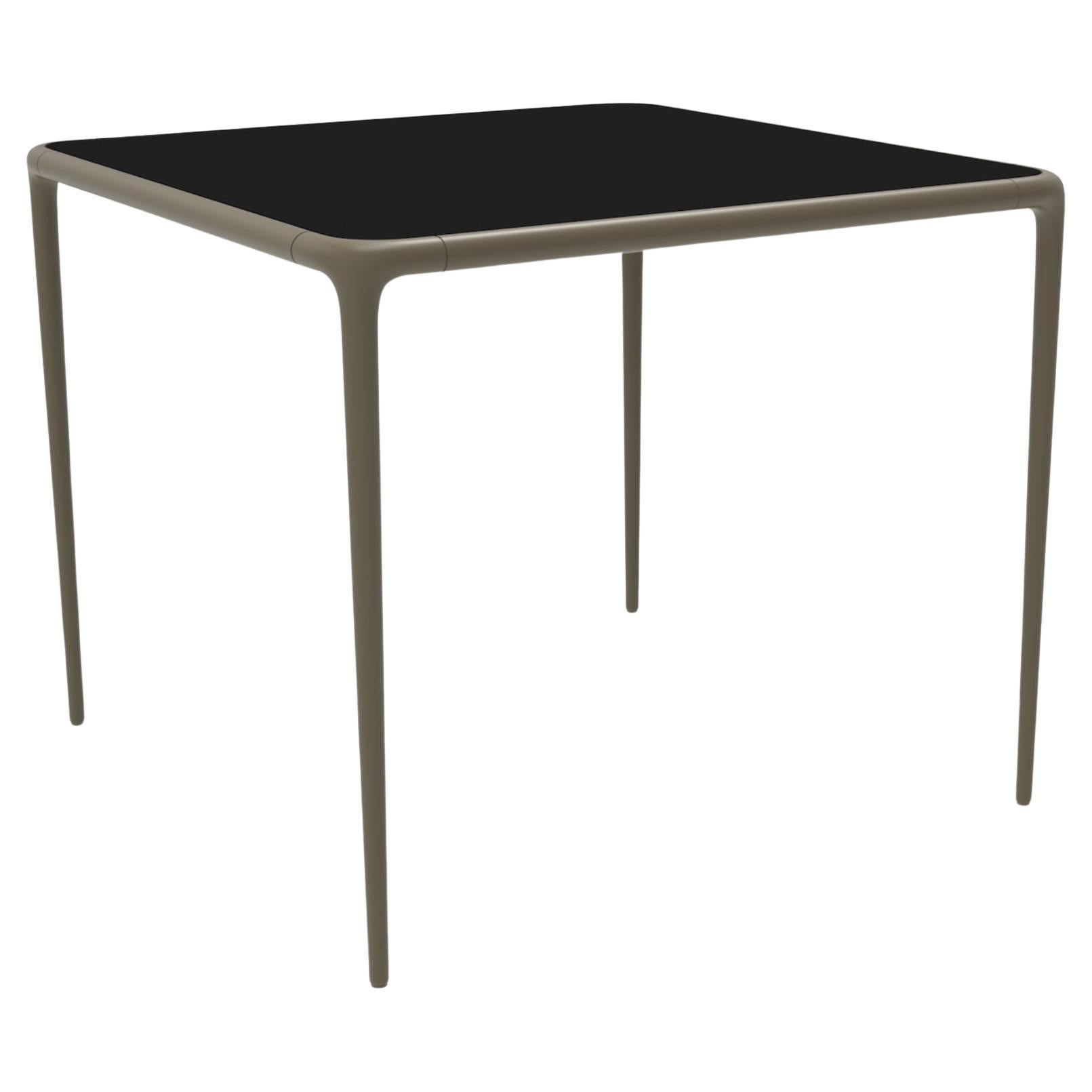 Xaloc Bronze Glass Top Table 90 by Mowee For Sale