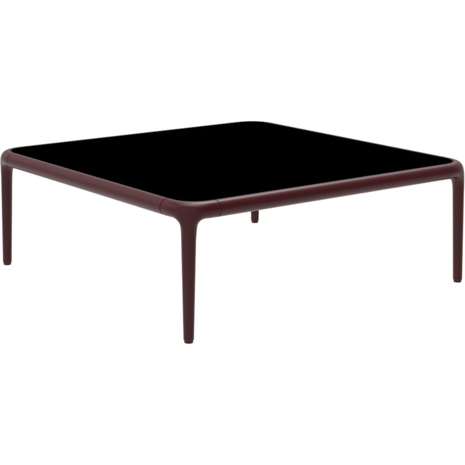 Xaloc burgundy coffee table 80 with glass top by Mowee.
Dimensions: D80 x W80 x H28 cm.
Materials: Aluminum, tinted tempered glass top.
Also available in different aluminum colors and finishes (HPL Black Edge or Neolith). 

Xaloc synthesizes