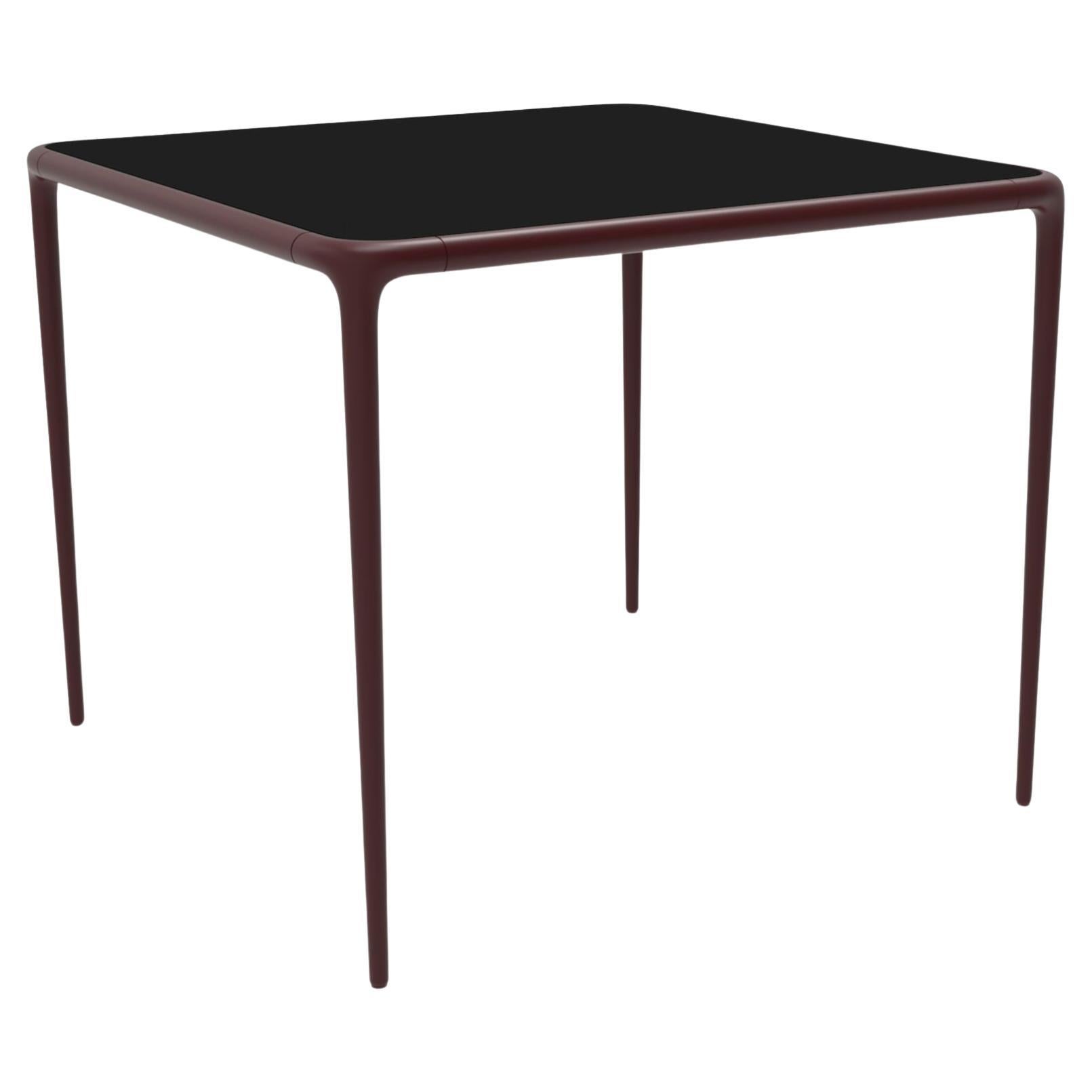 Xaloc Burgundy Glass Top Table 90 by Mowee For Sale