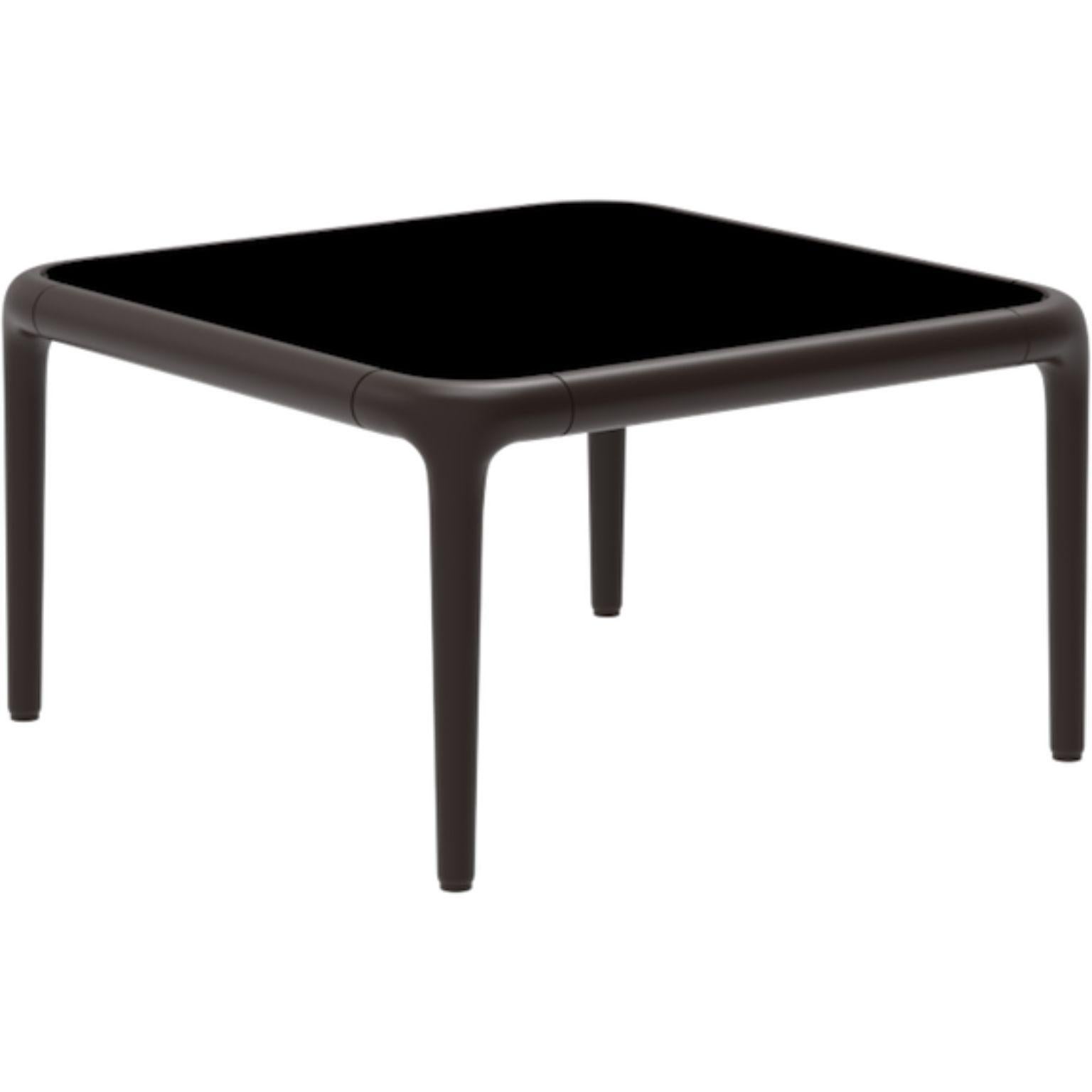 Xaloc chocolate coffee table 50 with glass top by MOWEE
Dimensions: D50 x W50 x H28 cm
Materials: Aluminum, tinted tempered glass top.
Also available in different aluminum colors and finishes (HPL Black Edge or Neolith). 

Xaloc synthesizes the