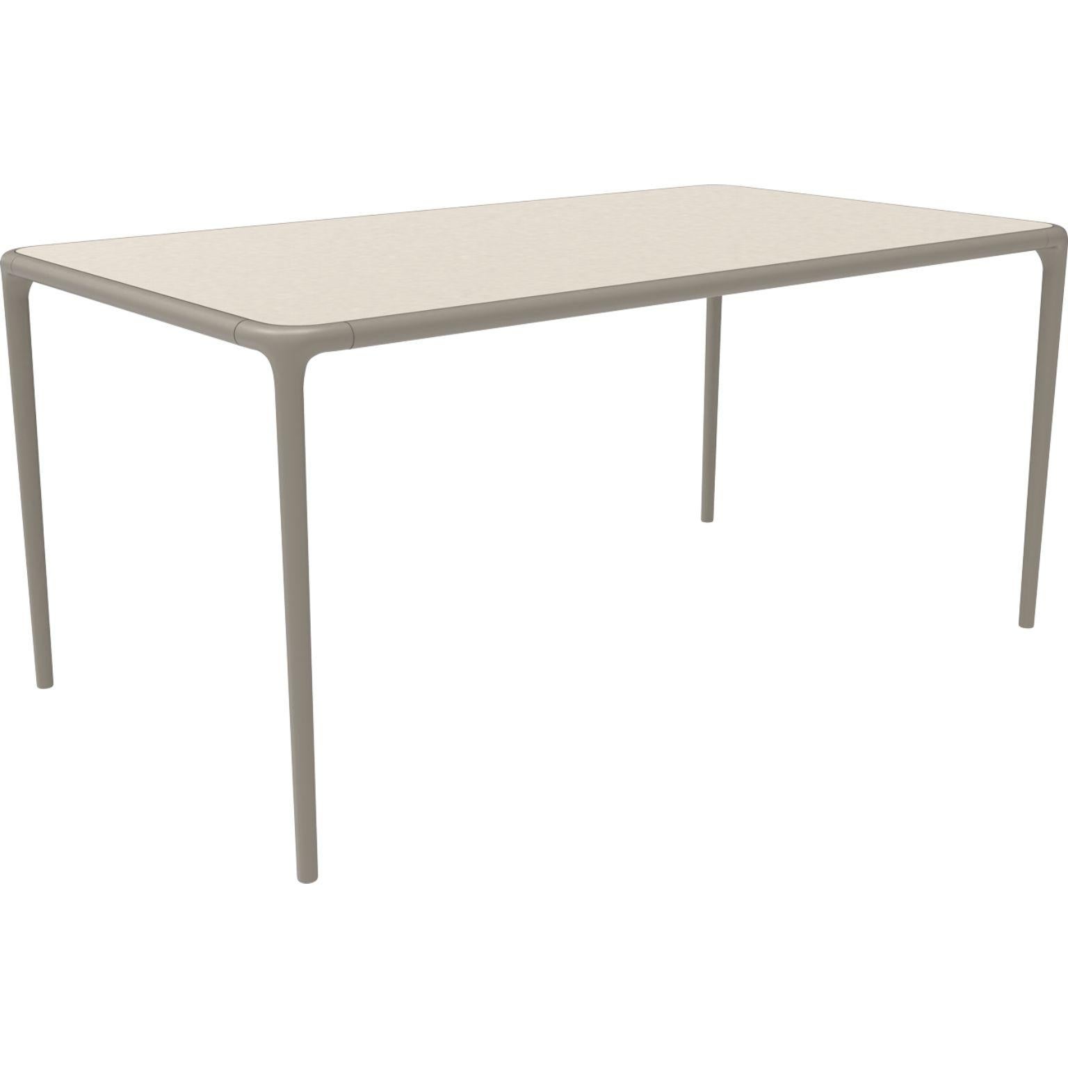 Xaloc cream glass top table 160 by Mowee
Dimensions: D 160 x W 90 x H 74 cm
Material: Aluminum, tinted tempered glass top.
Also available in different aluminum colors and finishes (HPL Black Edge or Neolith).

 Xaloc synthesizes the lines of