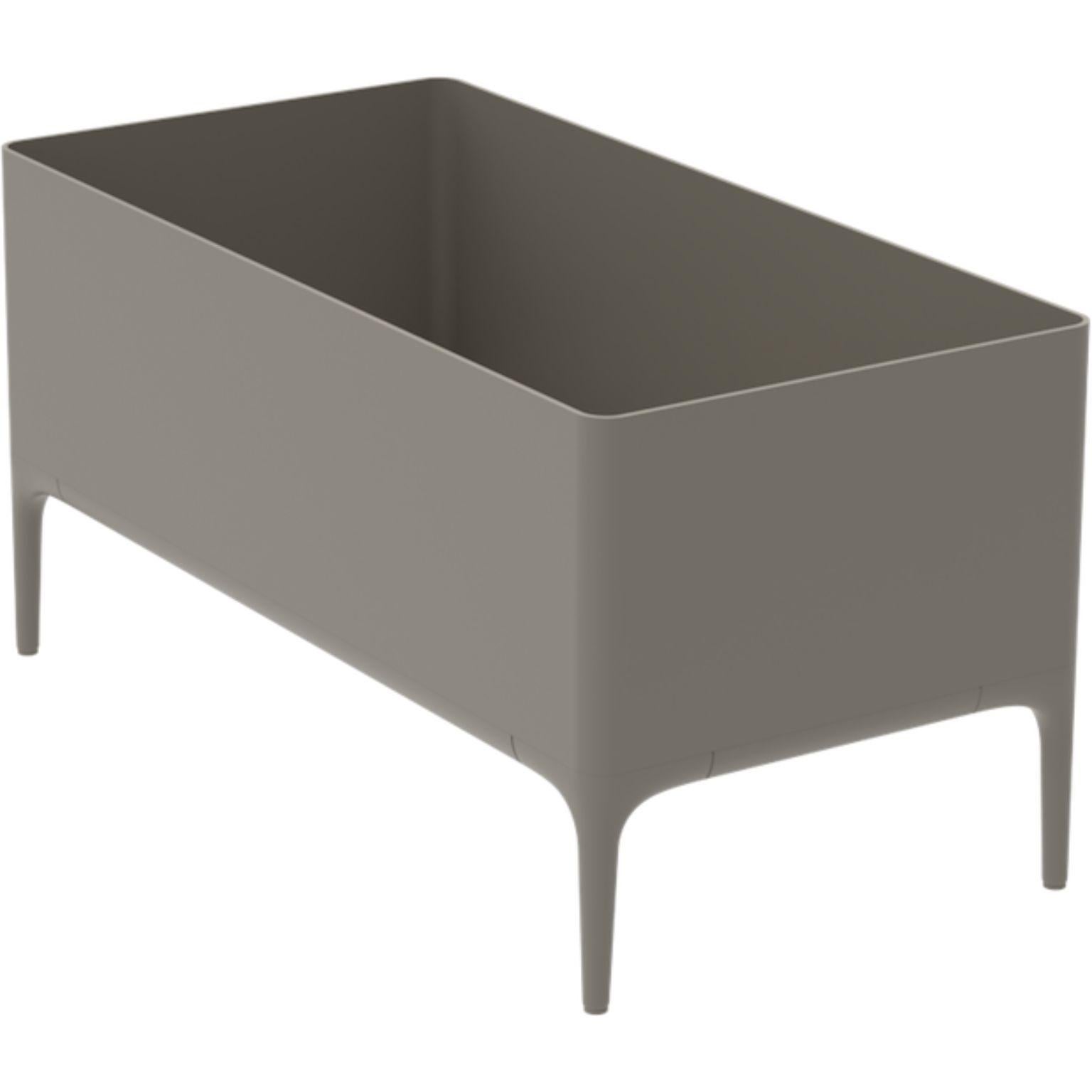 Xaloc Cream Planter by MOWEE
Dimensions: D90 x W45 x H45 cm
Material: Aluminium
Weight: 11 kg
Also Available in different colours and finishes. 

 Xaloc synthesizes the lines of interior furniture to extrapolate to the exterior, creating an