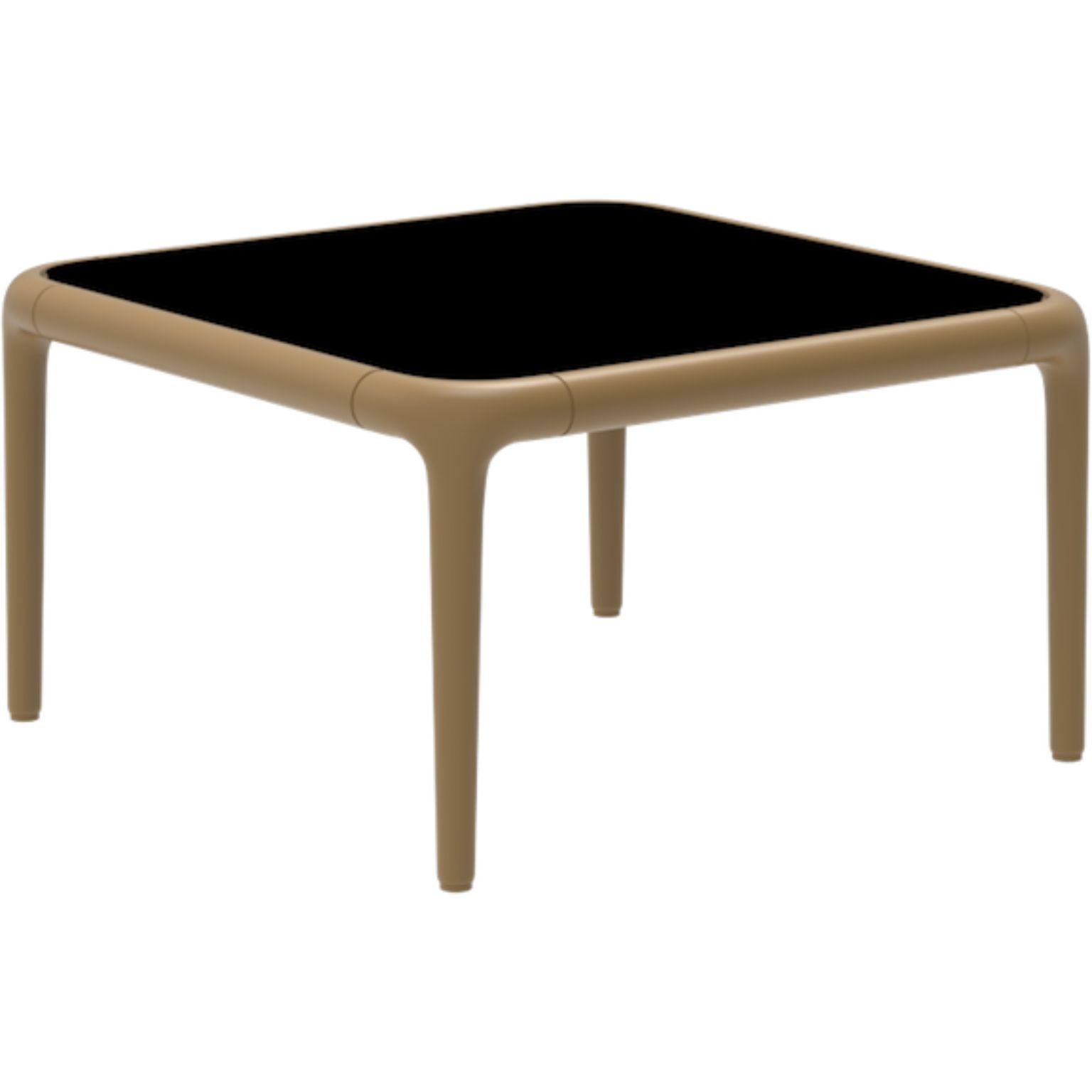 Xaloc gold coffee Table 50 with Glass Top by Mowee.
Dimensions: D50 x W50 x H28 cm.
Materials: Aluminum, tinted tempered glass top.
Also available in different aluminum colors and finishes (HPL Black Edge or Neolith). 

Xaloc synthesizes the