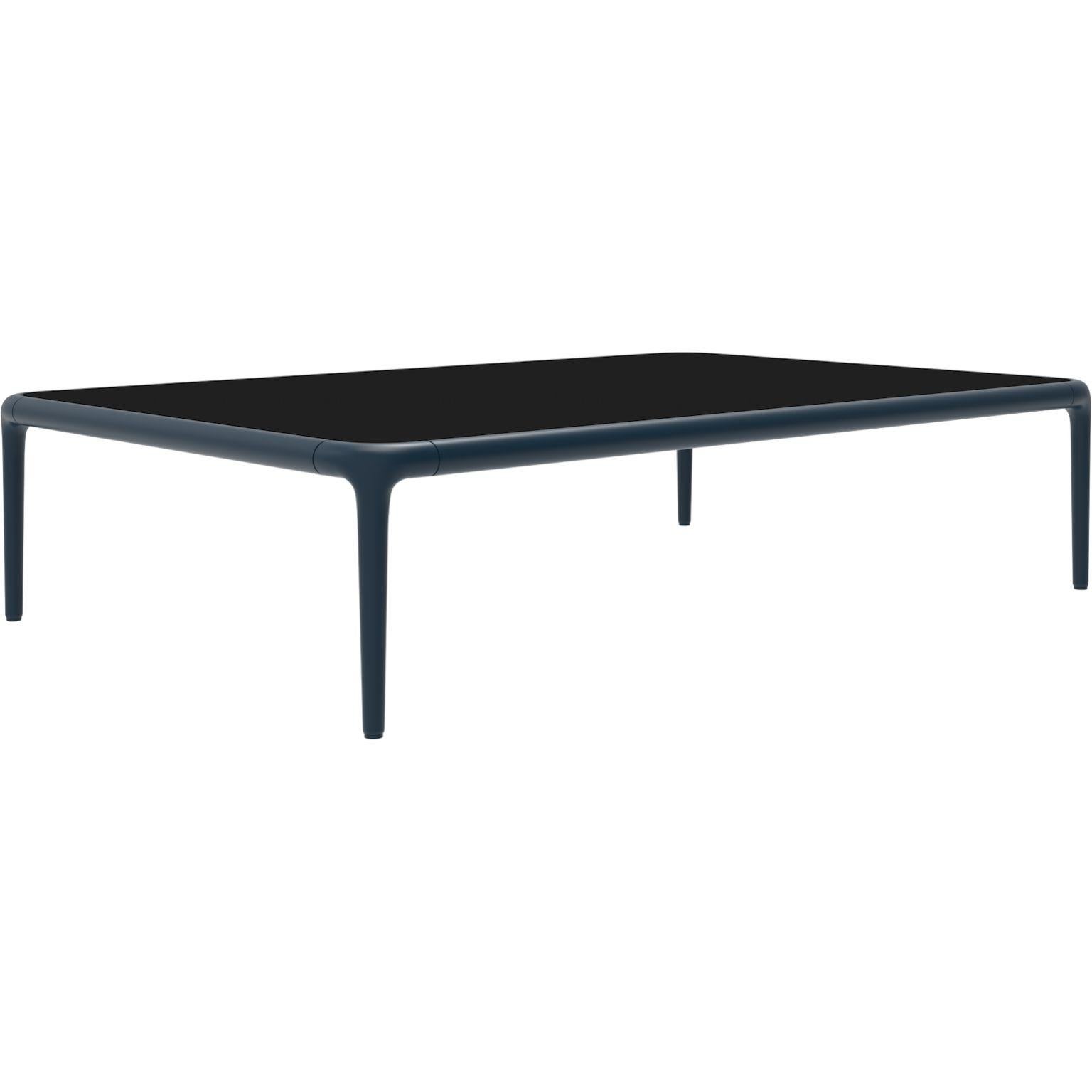 Xaloc navy coffee table 120 with glass Top by Mowee.
Dimensions: D120 x W80 x H28 cm.
Materials: Aluminum, tinted tempered glass top.
Also available in different aluminum colors and finishes (HPL Black Edge or Neolith).

Xaloc synthesizes the