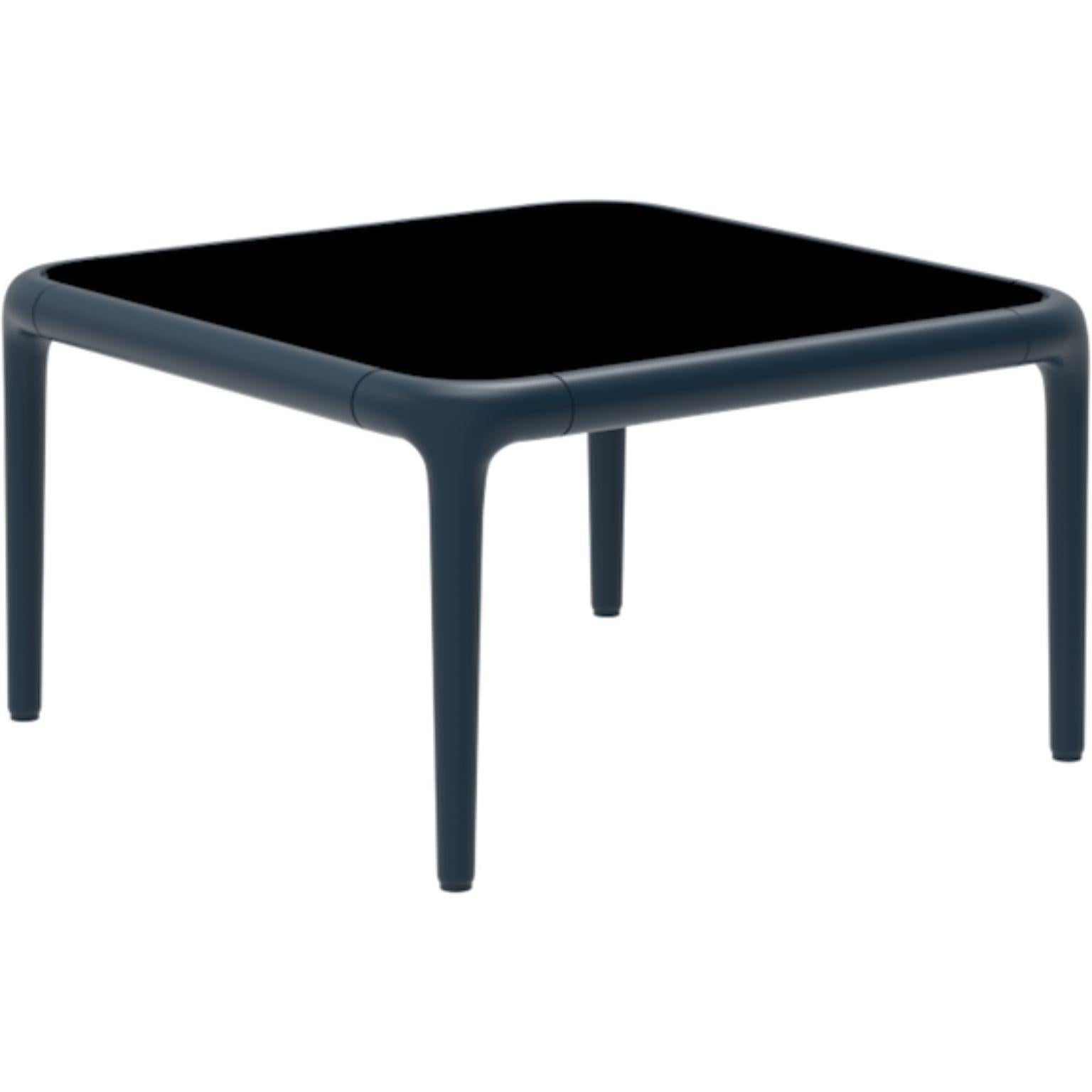 Xaloc navy coffee table 50 with glass top by MOWEE
Dimensions: D50 x W50 x H28 cm
Materials: Aluminum, tinted tempered glass top.
Also available in different aluminum colors and finishes (HPL Black Edge or Neolith).

Xaloc synthesizes the lines