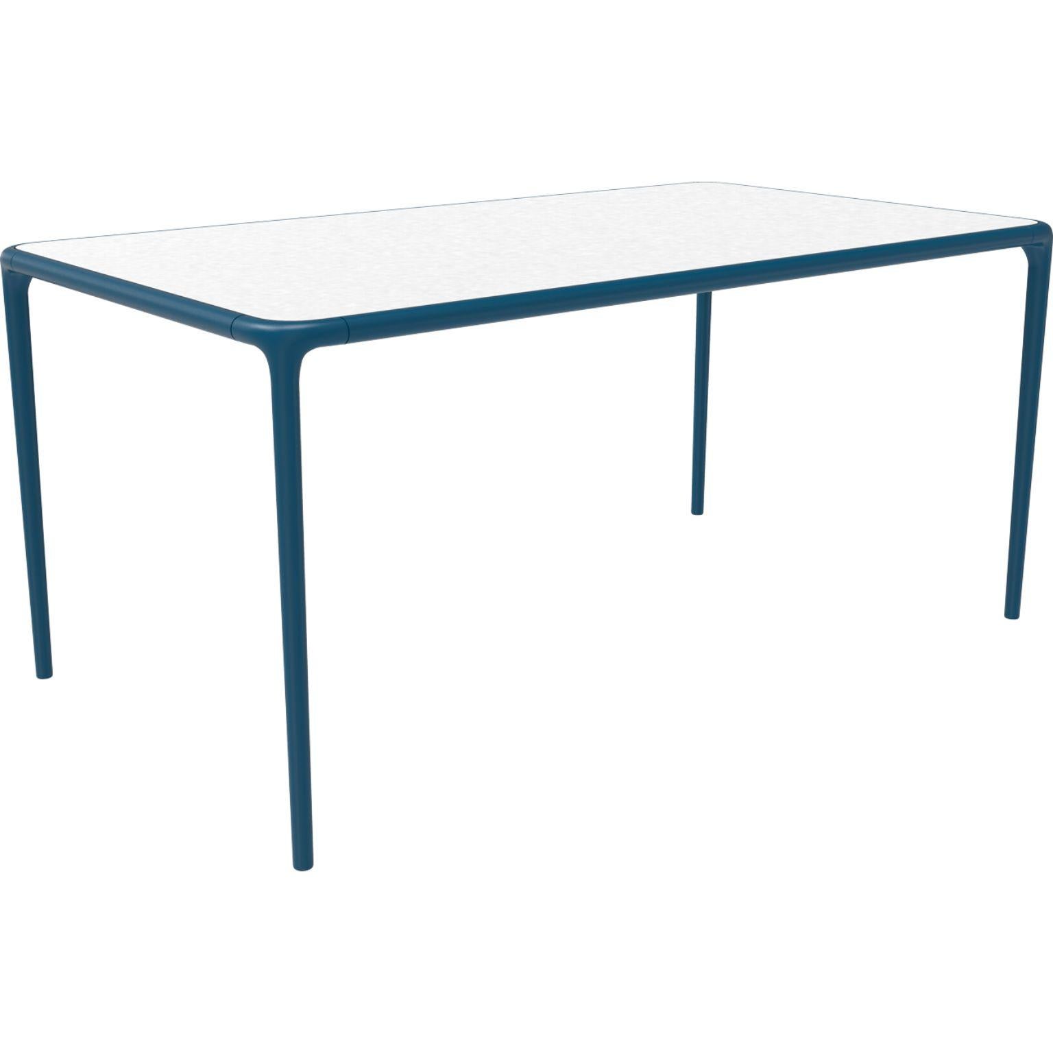 Xaloc navy glass top table 160 by MOWEE
Dimensions: D160 x W90 x H74 cm
Material: Aluminum, tinted tempered glass top.
Also available in different aluminum colors and finishes (HPL Black Edge or Neolith). 

Xaloc synthesizes the lines of