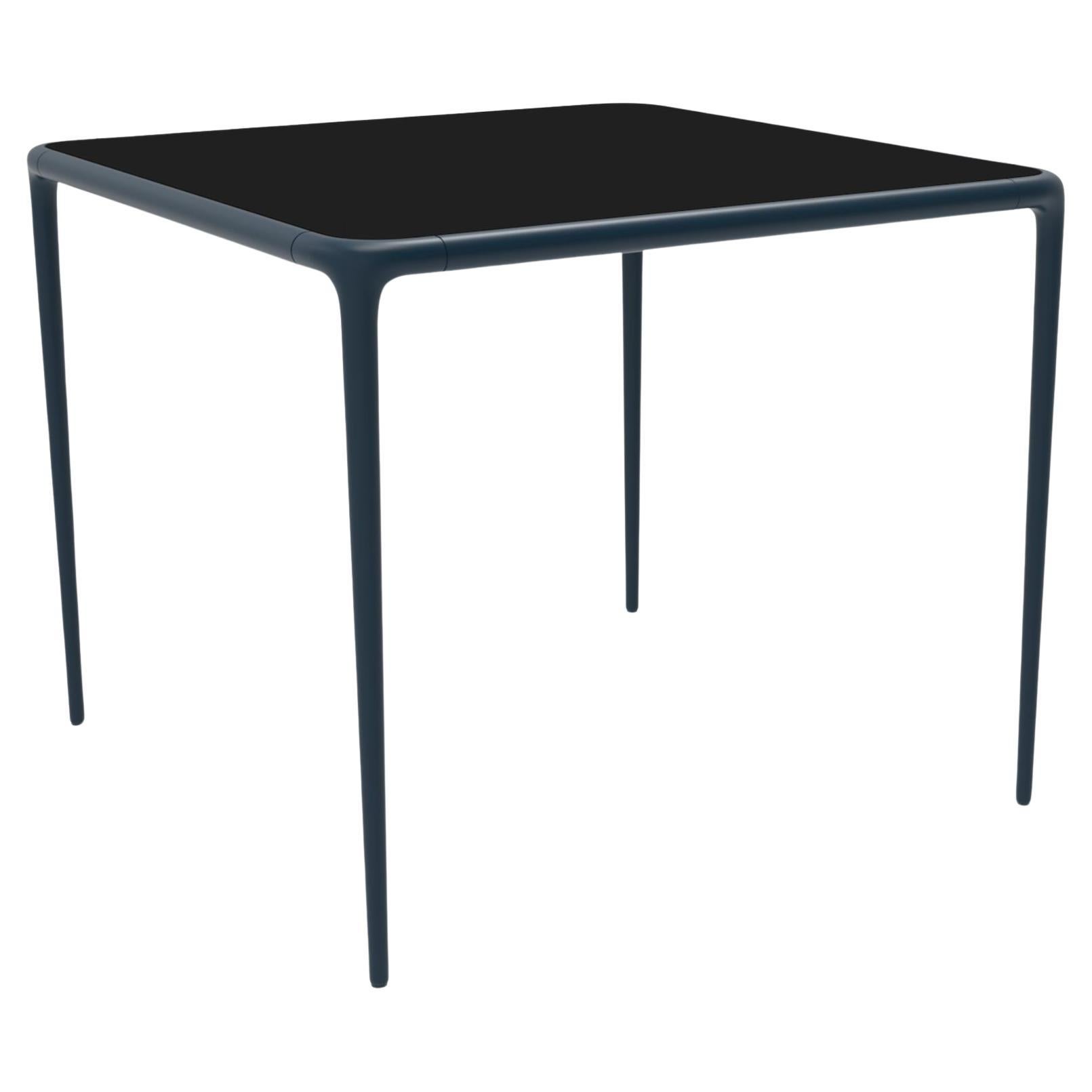 Xaloc Navy Glass Top Table 90 by Mowee For Sale