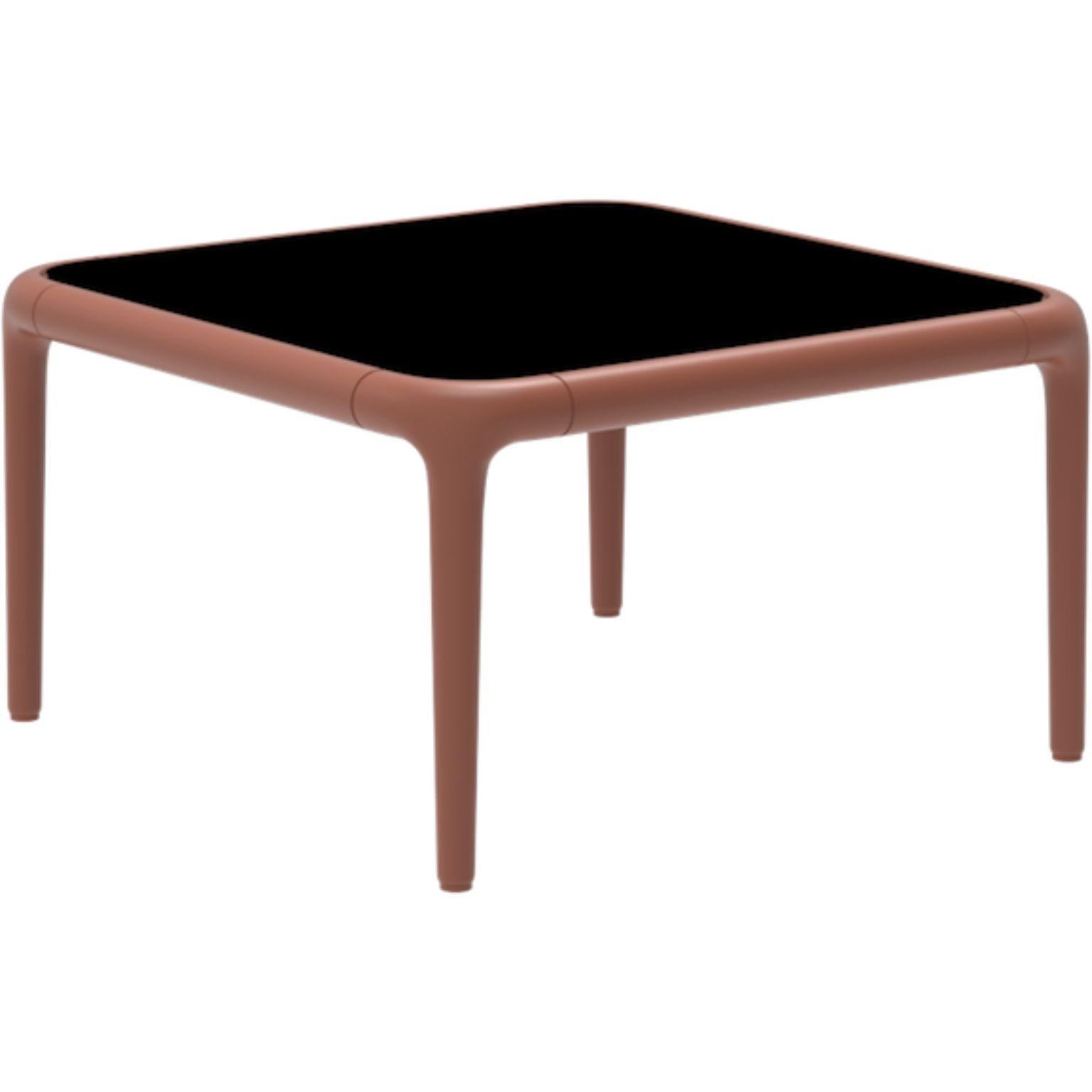 Xaloc salmon coffee table 50 with glass top by MOWEE
Dimensions: D50 x W50 x H28 cm
Materials: Aluminum, tinted tempered glass top.
Also available in different aluminum colors and finishes (HPL Black Edge or Neolith). 

Xaloc synthesizes the