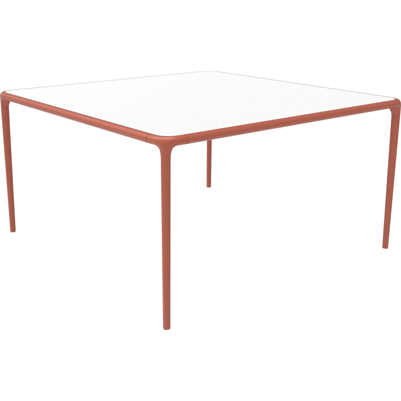 Xaloc Salmon glass top table 140 by Mowee
Dimensions: D 140 x W 140 x H 74 cm
Material: Aluminum, tinted tempered glass top.
Also available in different aluminum colors and finishes (HPL Black Edge or Neolith).

 Xaloc synthesizes the lines of