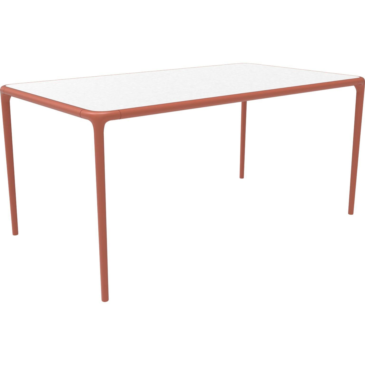 Xaloc Salmon glass top table 160 by Mowee
Dimensions: D 160 x W 90 x H 74 cm
Material: Aluminum, tinted tempered glass top.
Also available in different aluminum colors and finishes (HPL Black Edge or Neolith).

 Xaloc synthesizes the lines of