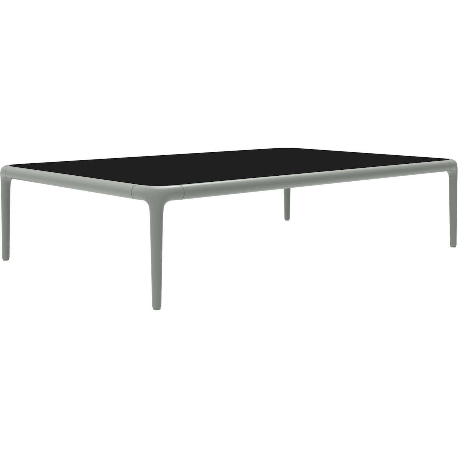Xaloc silver coffee table 120 with glass top by Mowee.
Dimensions: D120 x W80 x H28 cm.
Materials: Aluminum, tinted tempered glass top.
Also available in different aluminum colors and finishes (HPL Black Edge or Neolith). 

Xaloc synthesizes