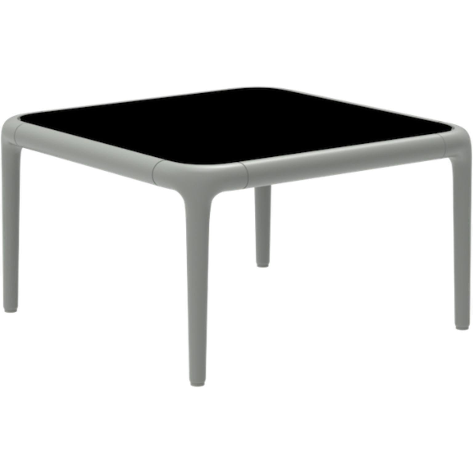 Xaloc Silver coffee table 120 with glass top by MOWEE
Dimensions: D50 x W50 x H28 cm
Materials: Aluminum, tinted tempered glass top.
Also available in different aluminum colors and finishes (HPL Black Edge or Neolith). 

Xaloc synthesizes the