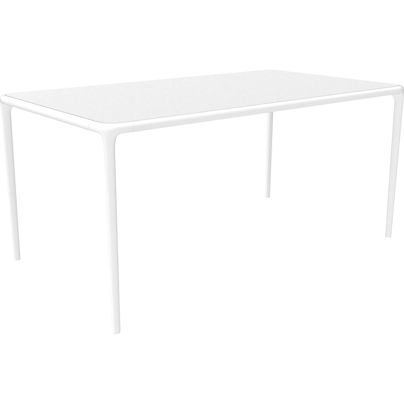 Xaloc white glass top table 160 by MOWEE
Dimensions: D160 x W90 x H74 cm
Material: Aluminum, tinted tempered glass top.
Also available in different aluminum colors and finishes (HPL Black Edge or Neolith). 

Xaloc synthesizes the lines of