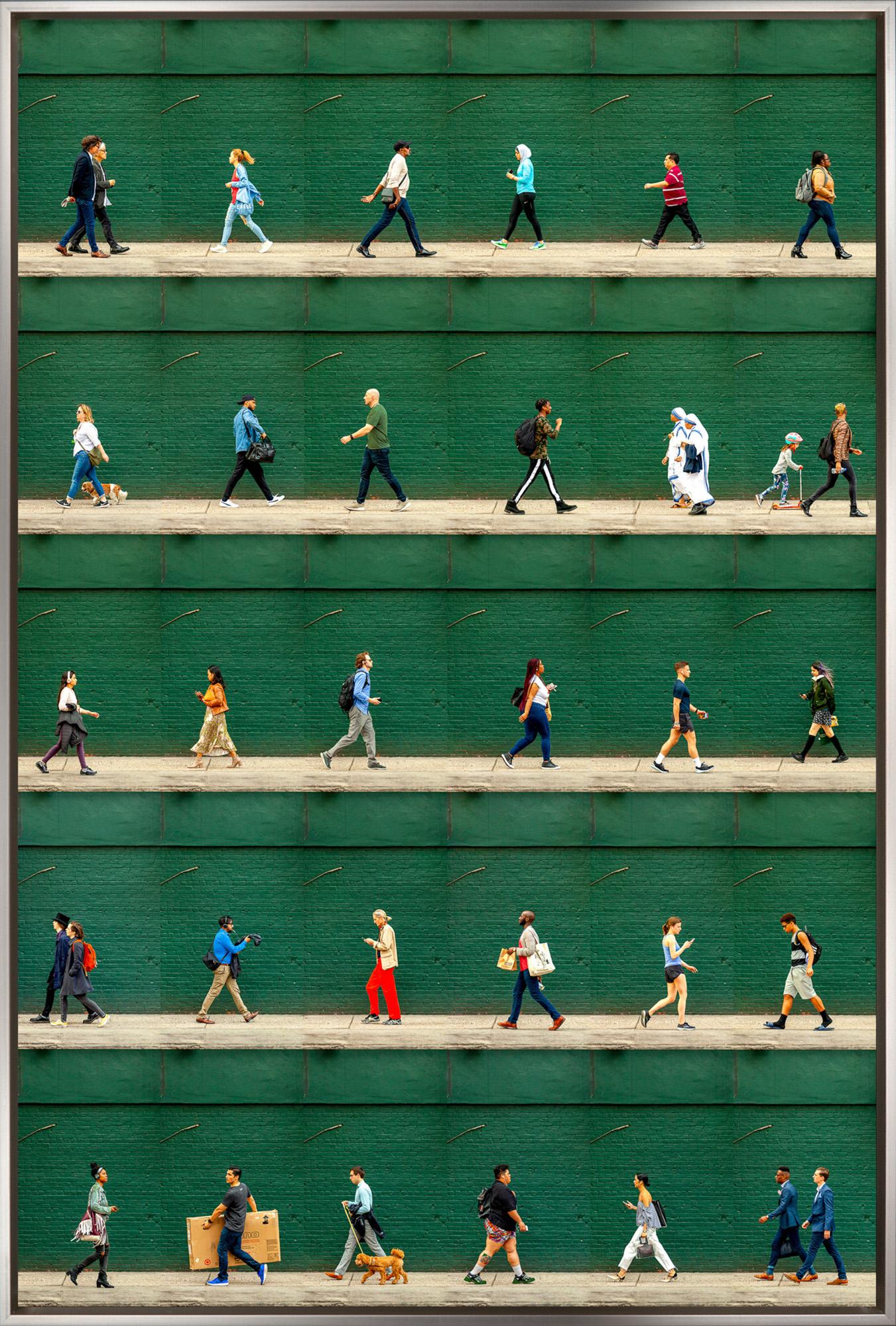 "Christopher Street, NYC" is a framed photograph on aluminum by Xan Padron, depicting a compilation of walking figures set against a painted green brick background. Padron's signature technique of splicing together individual photographs to craft a