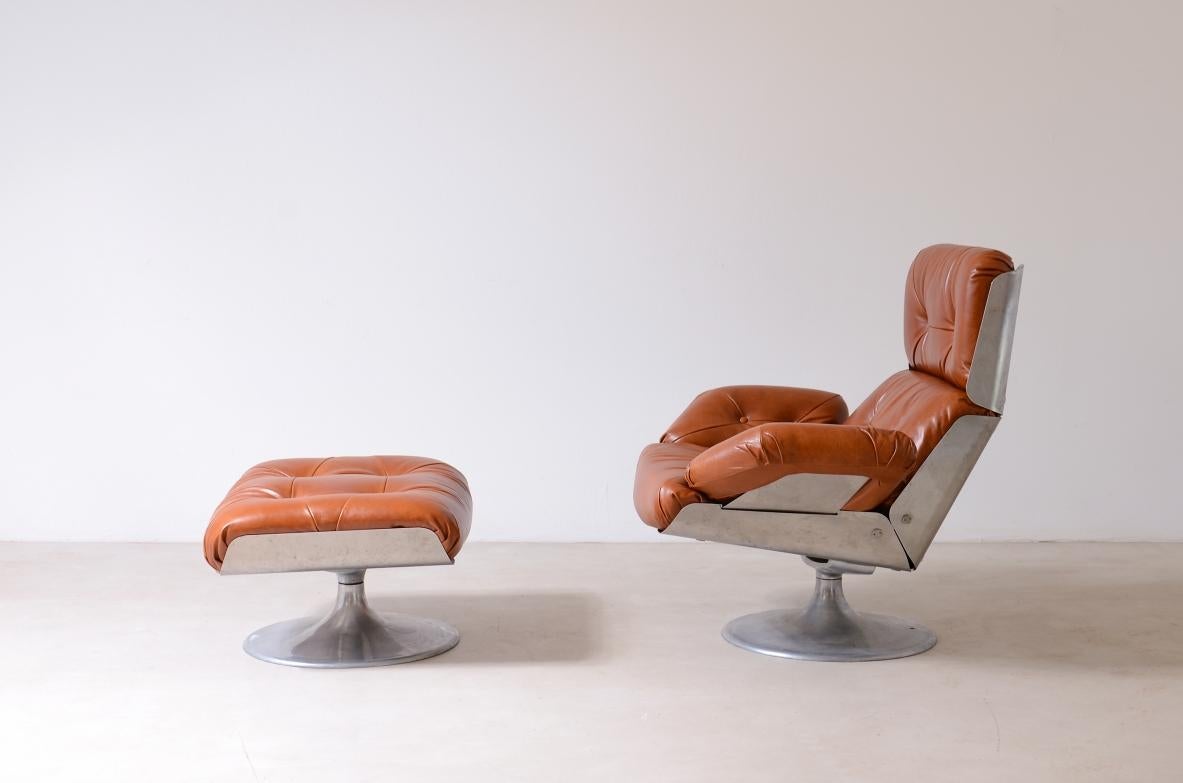 Space Age Xavier Feal  rare swivel chair with footrest in curved steel For Sale