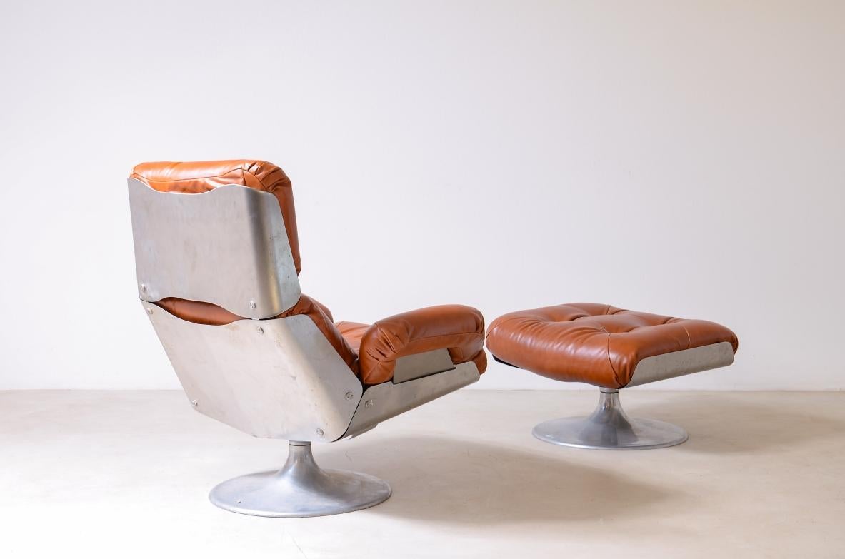 French Xavier Feal  rare swivel chair with footrest in curved steel For Sale