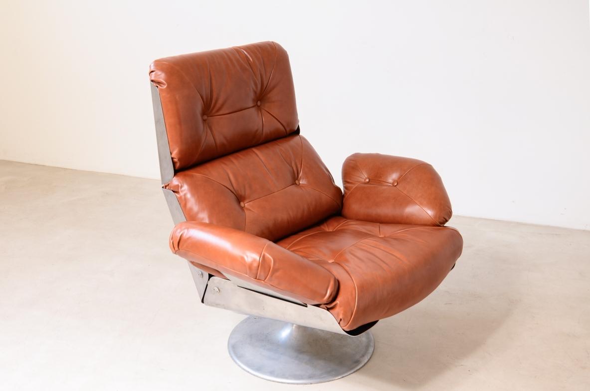 20th Century Xavier Feal  rare swivel chair with footrest in curved steel For Sale
