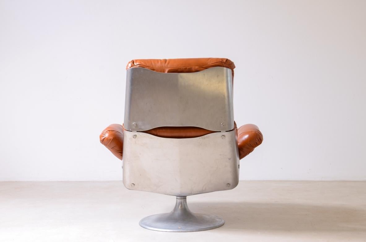 Steel Xavier Feal  rare swivel chair with footrest in curved steel For Sale