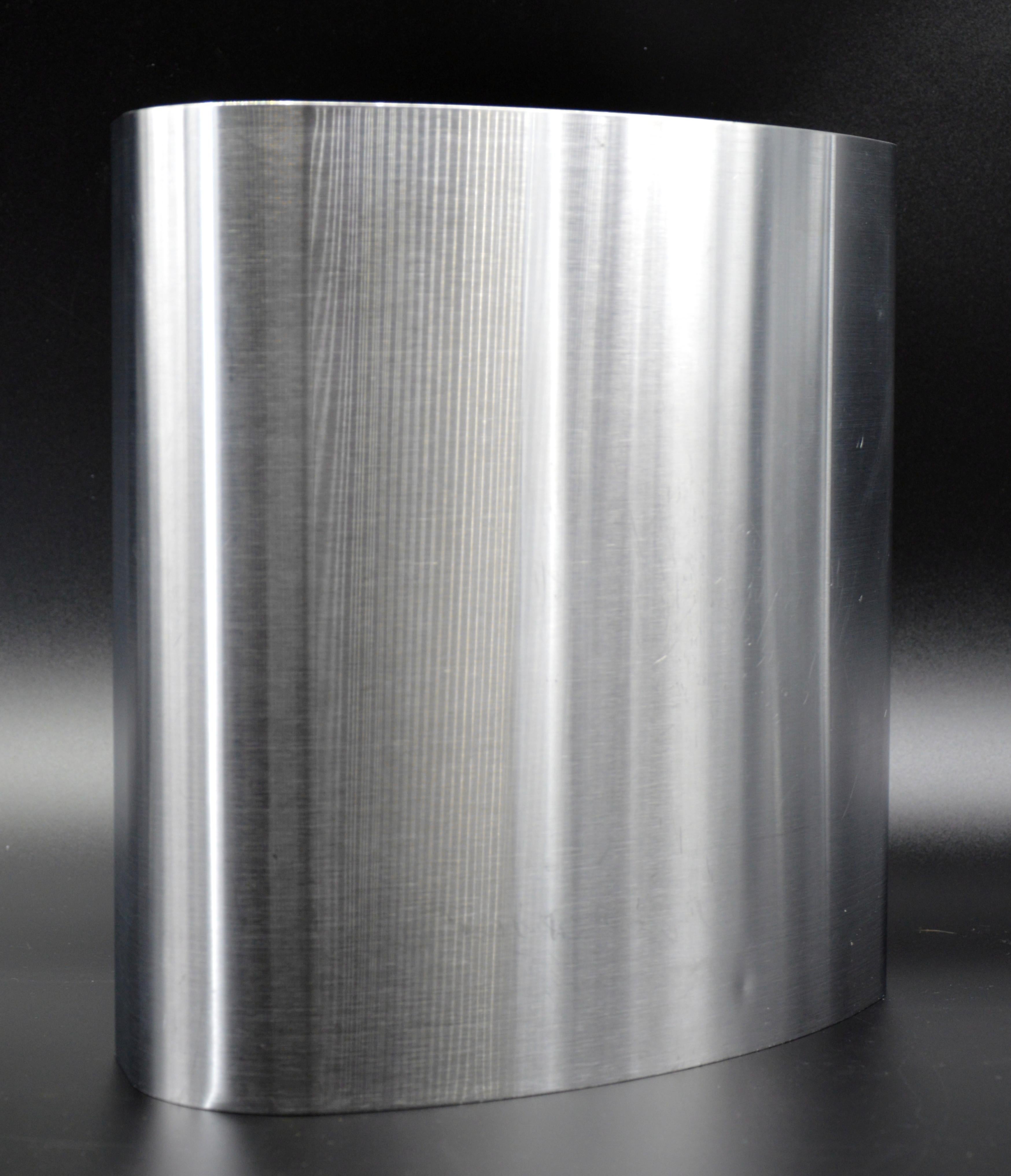 Mid-century paper bin by Xavier FEAL, France, ca.1970. Brushed stainless steel paper bin. Pinched toe with a ring opening for carrying it. Wooden bottom. Height : 11.8