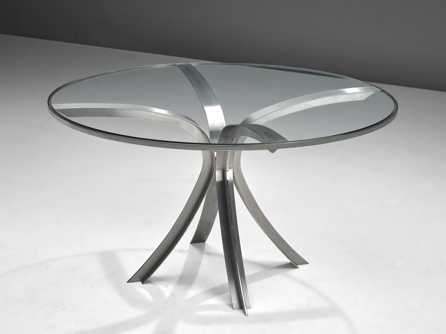 Xavier Fréal, dining or center table, glass, stainless steel, France, 1970s. 

This outstanding table is designed by French designer Xavier Fréal. This design is based on a well thought out construction that is aesthetically pleasing. The whole unit