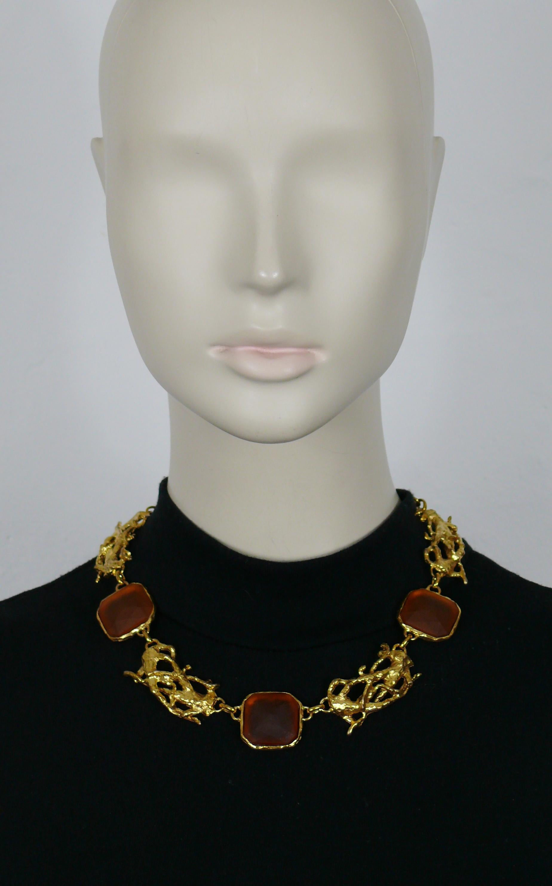 XAVIER LOUBENS vintage gold tone link necklace featuring an intricated design, embellished with 3 large frosted glass cabochons in amber colour. 

T-bar toggle loop closure.

Marked XAVIER LOUBENS Paris Made in France.

Indicative measurements :
