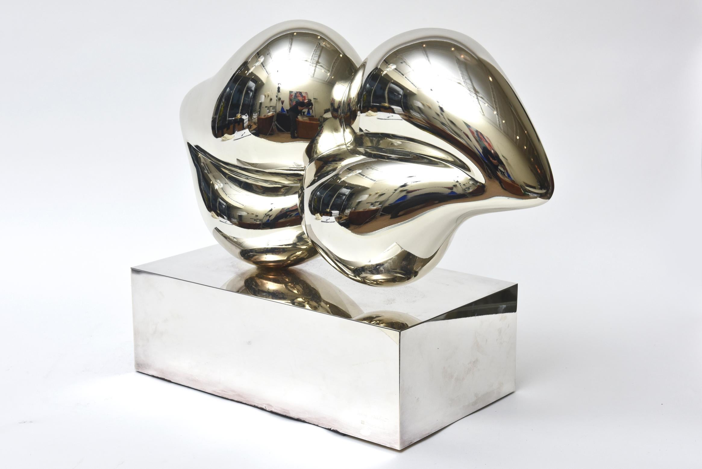 This stellar powerful and conversational silvered bronze and sterling silver limited edition abstracted love lips or heart sculpture was commissioned by Christofle and designed and executed by a young Chinese woman artist named Xiao Hui Wang. This