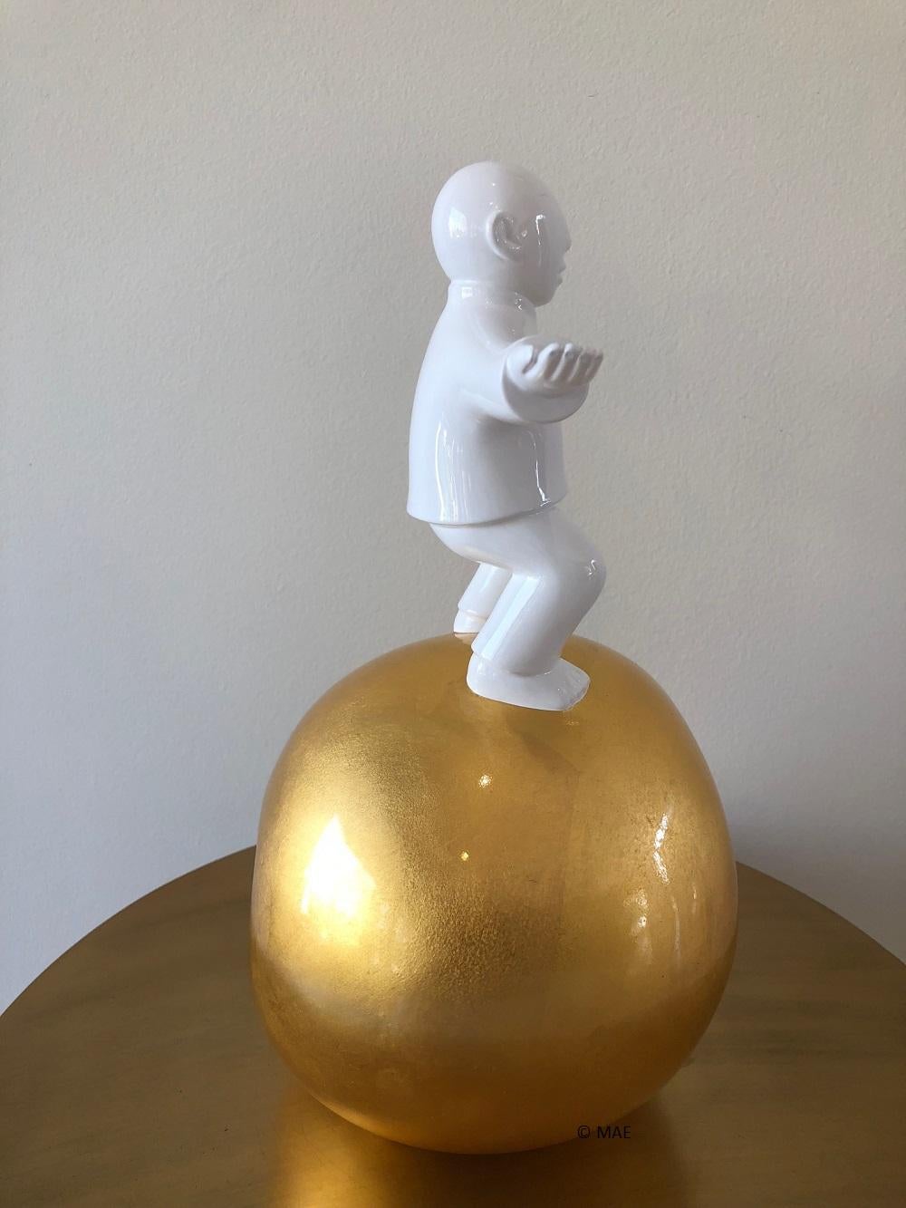 This is a fibre glass sculpture by the noted Chinese artist, Xie Ai Ge, that is hand laid with 99.99% gold leaf, varnished. The symbolic significance of this piece is as follows:

The Apple series in general symbolizes Man's will to overcome