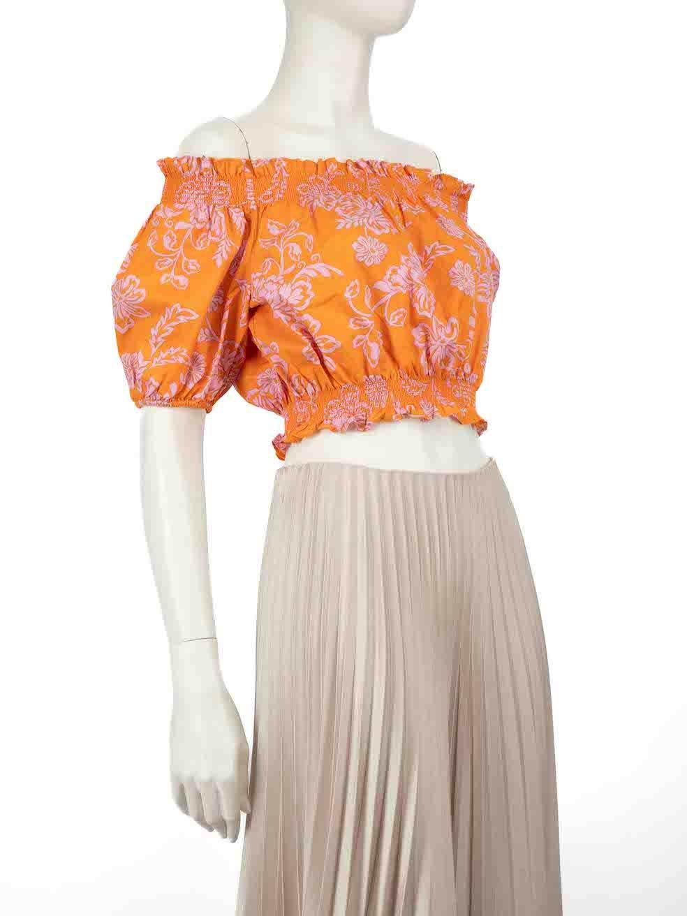CONDITION is Very good. Hardly any visible wear to the top is evident on this used Xirena designer resale item.
 
 
 
 Details
 
 
 Orange
 
 Cotton
 
 Top
 
 Floral print
 
 Cropped fit
 
 Short puff sleeves
 
 Off the shoulder
 
 Elasticated