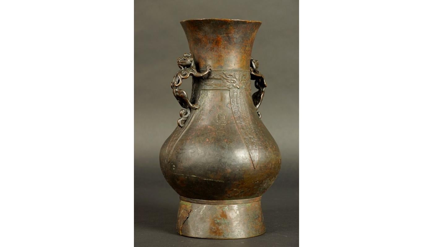 14th-15th century China bronze vase late Yuan / early Ming Dynasty
The vase has a round belly tapering upwards into a rather wide neck, based on a high foot. Decorated with motifs reminiscent of masks and oblong leaves. Vase handles in the shape of