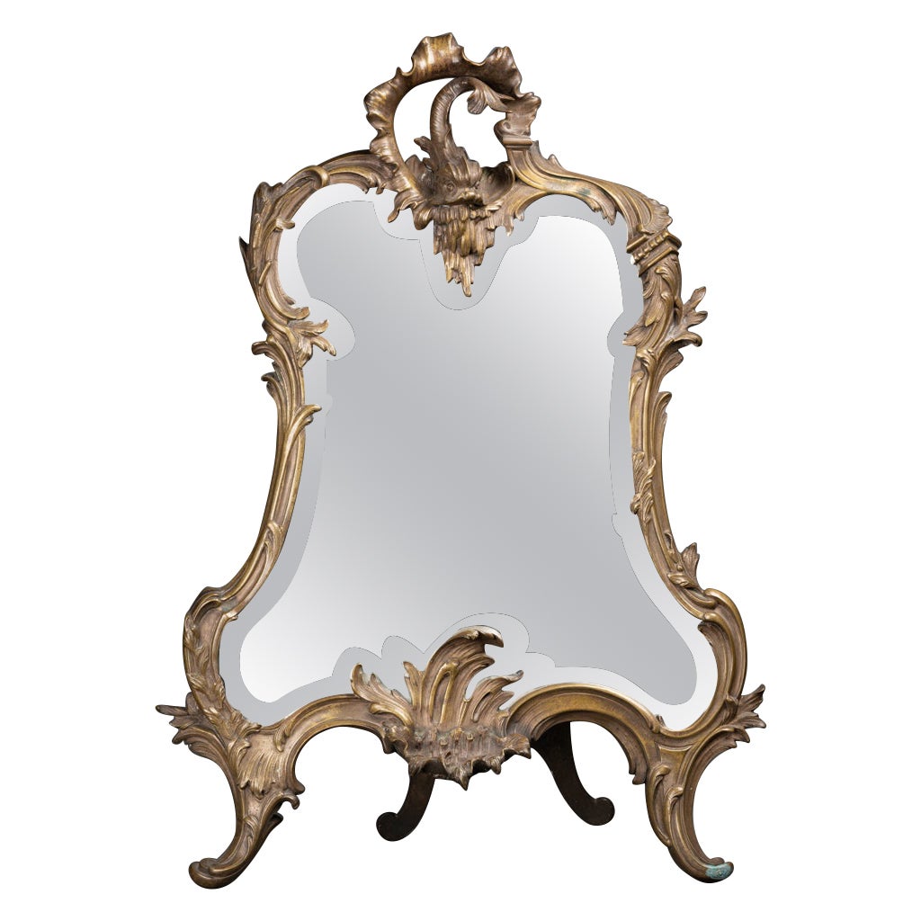 XIXth c. tall patinated bronze mirror with dolphin decor