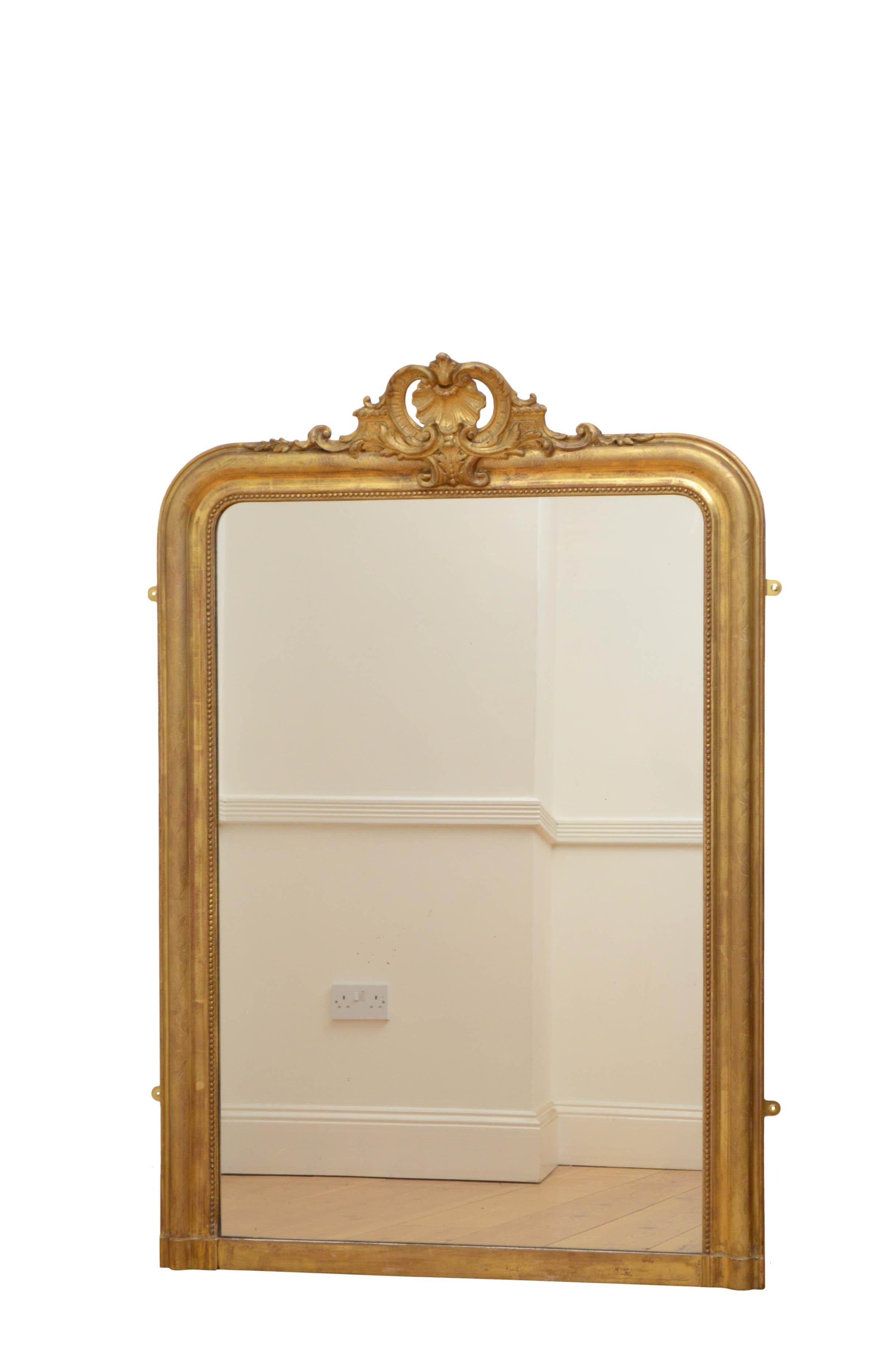 K0493 outstanding French overmantel mirror or wall mirror, having original glass with some foxing in beaded and moulded with floral etched decoration and shell crest to centre. This attractive wall mirror retains its original glass, gilt and