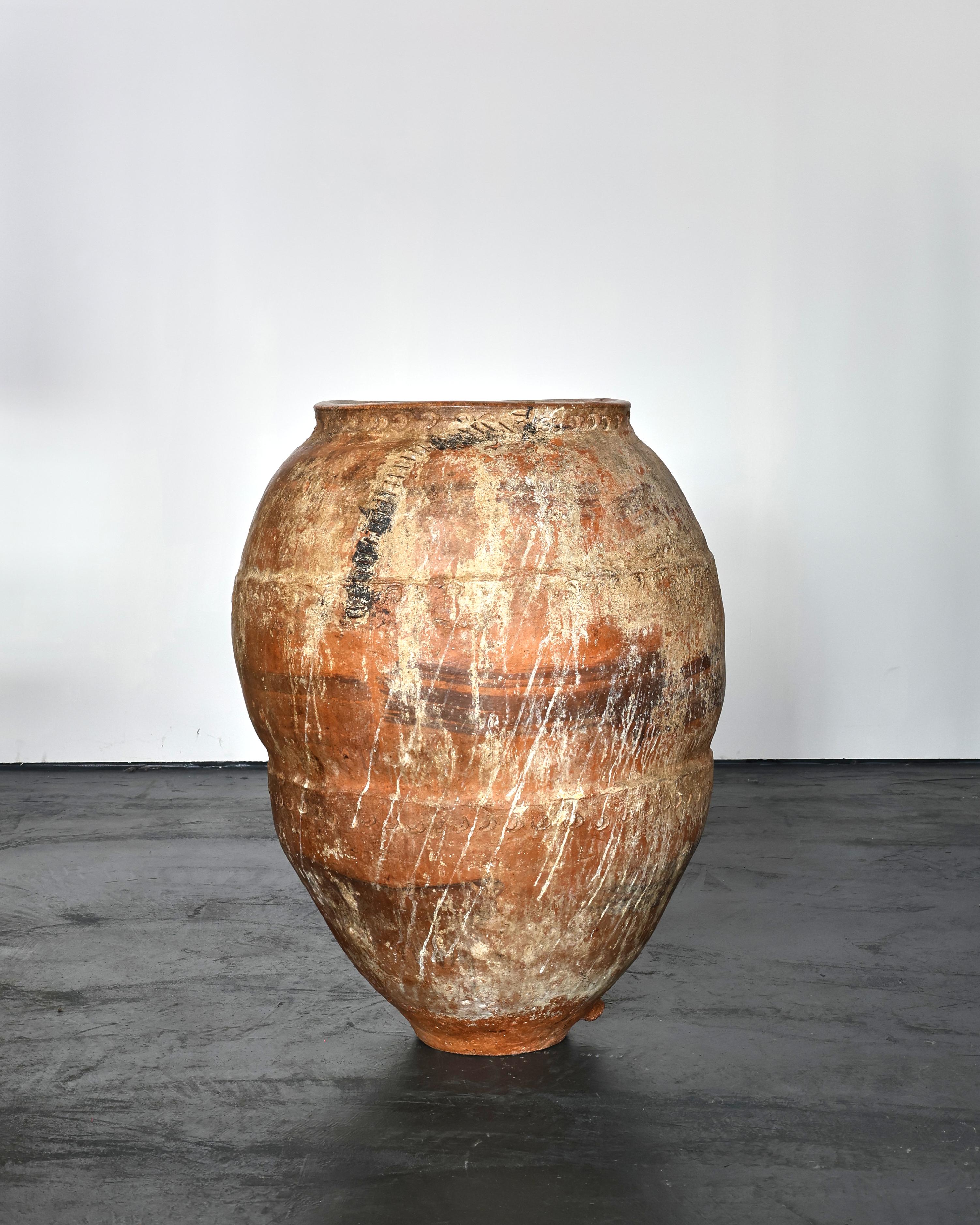 An XL terracotta vessel from the town of Calanda, Spain

Heavily, heavily patinated due to years of use with multiple old staple repairs.

Originally used for the storage/transportation of wine.

Opening of vessel measures roughly 38cm.