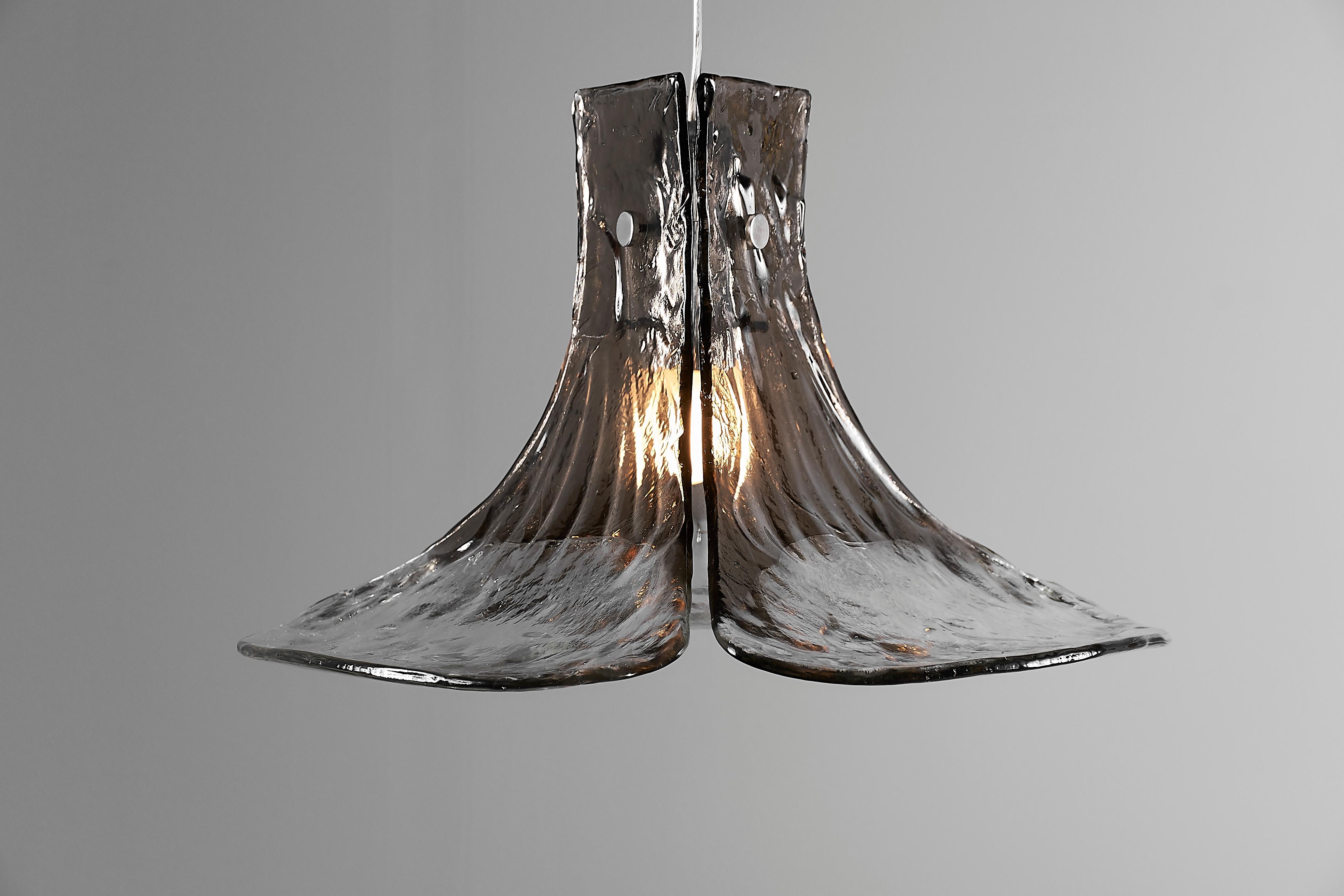 Mid-Century Modern floral pendant light. Three large and very thick hand blown clear and smoked Murano glass petals are supported by a metal frame. 

Design by Carlo Nason for Kalmar Franken lighting Austria, handmade by renowned Murano glassworks,