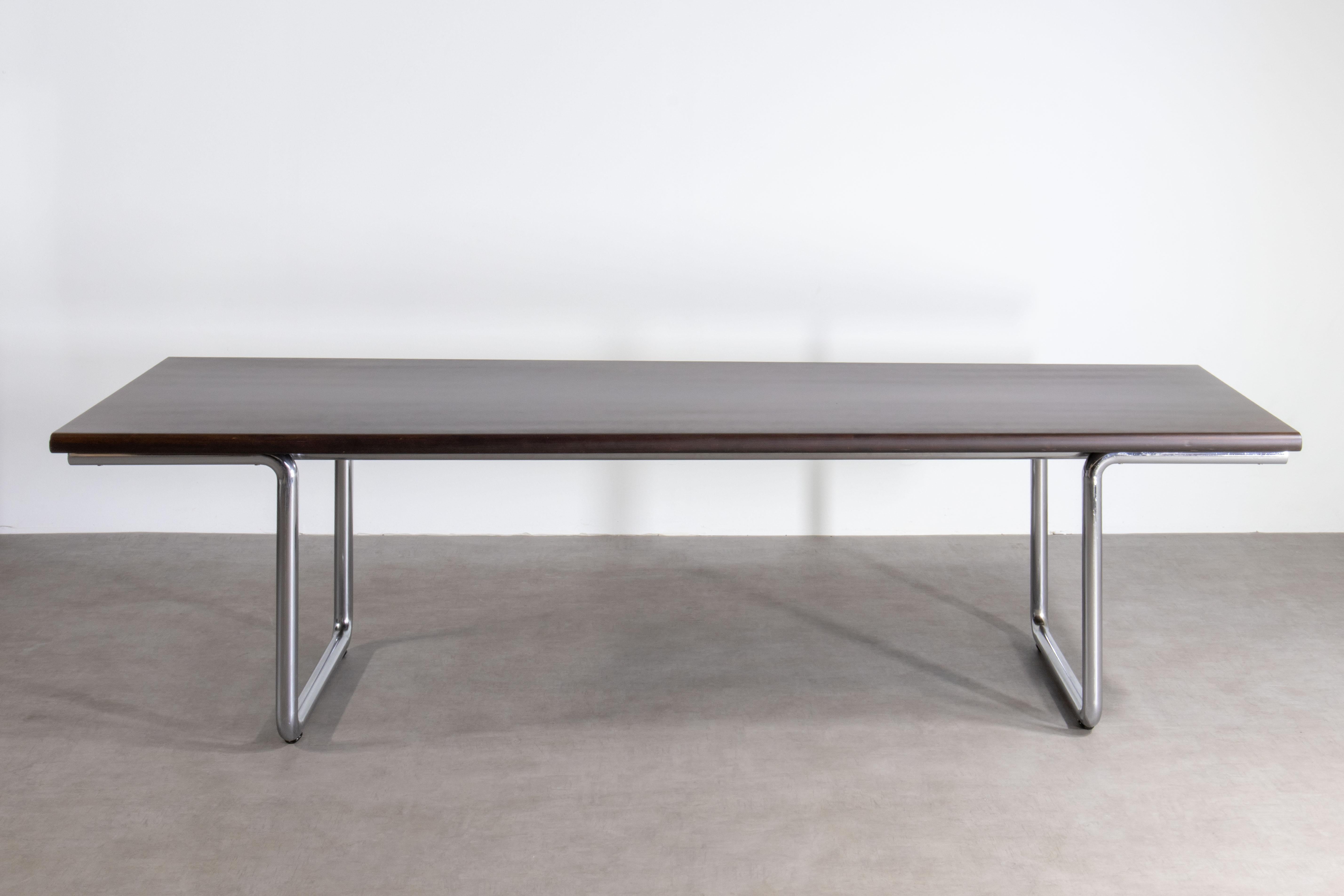 This LC table was designed in 1975 and manufactured on September 26th, 1979 by Anonima Castelli in Bologna, Italy. This version is the extra-long 12-seat conference table or dining table. Measuring 110 in (280 cm) long and 37 in (94 cm) wide. It