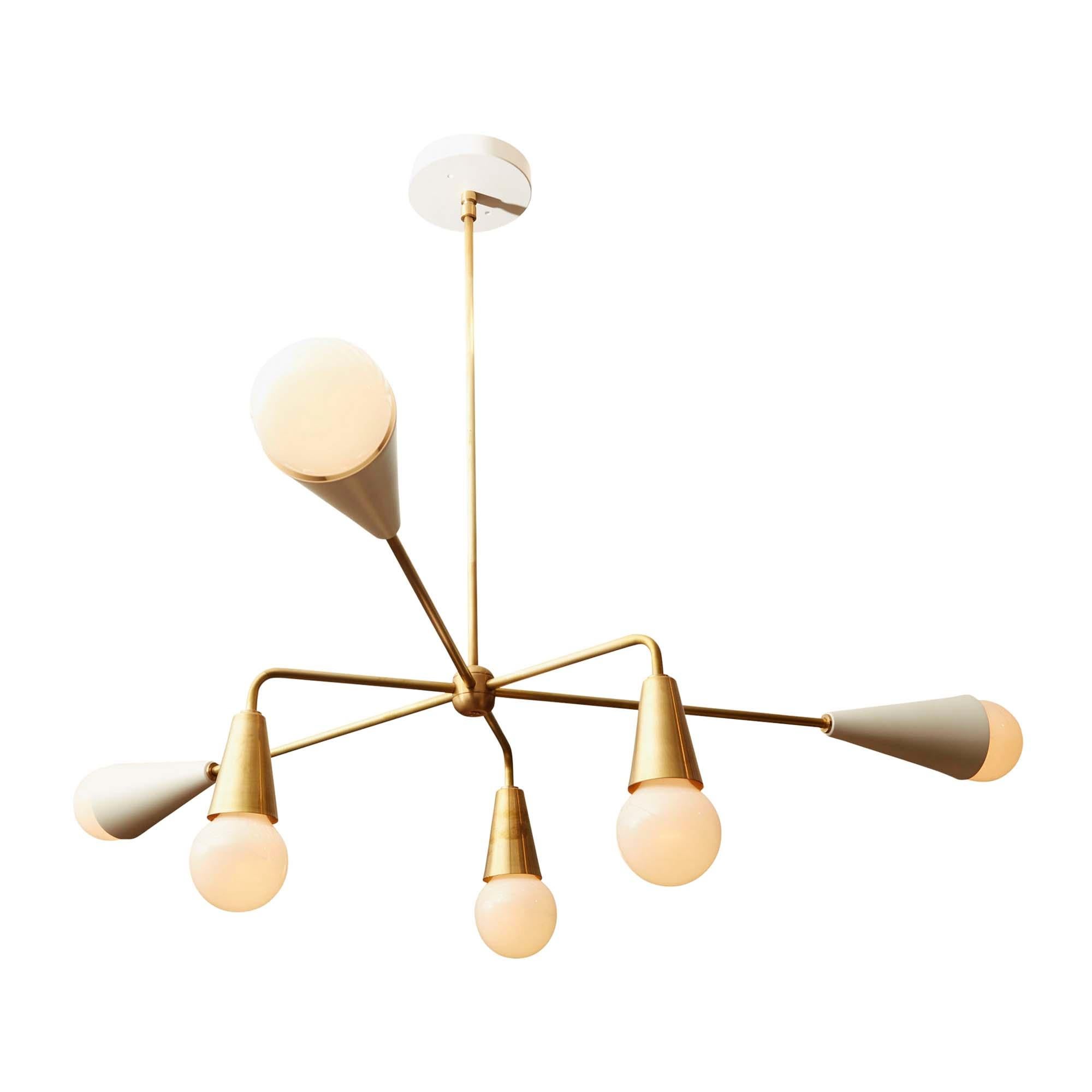 The XL 6-Globe chandelier features six arms that are centered on a brass rod. Three of the globes are angled down with brass shades. The other three have powdercoated shades.

The Lawson-Fenning Collection is designed and handmade in Los Angeles,