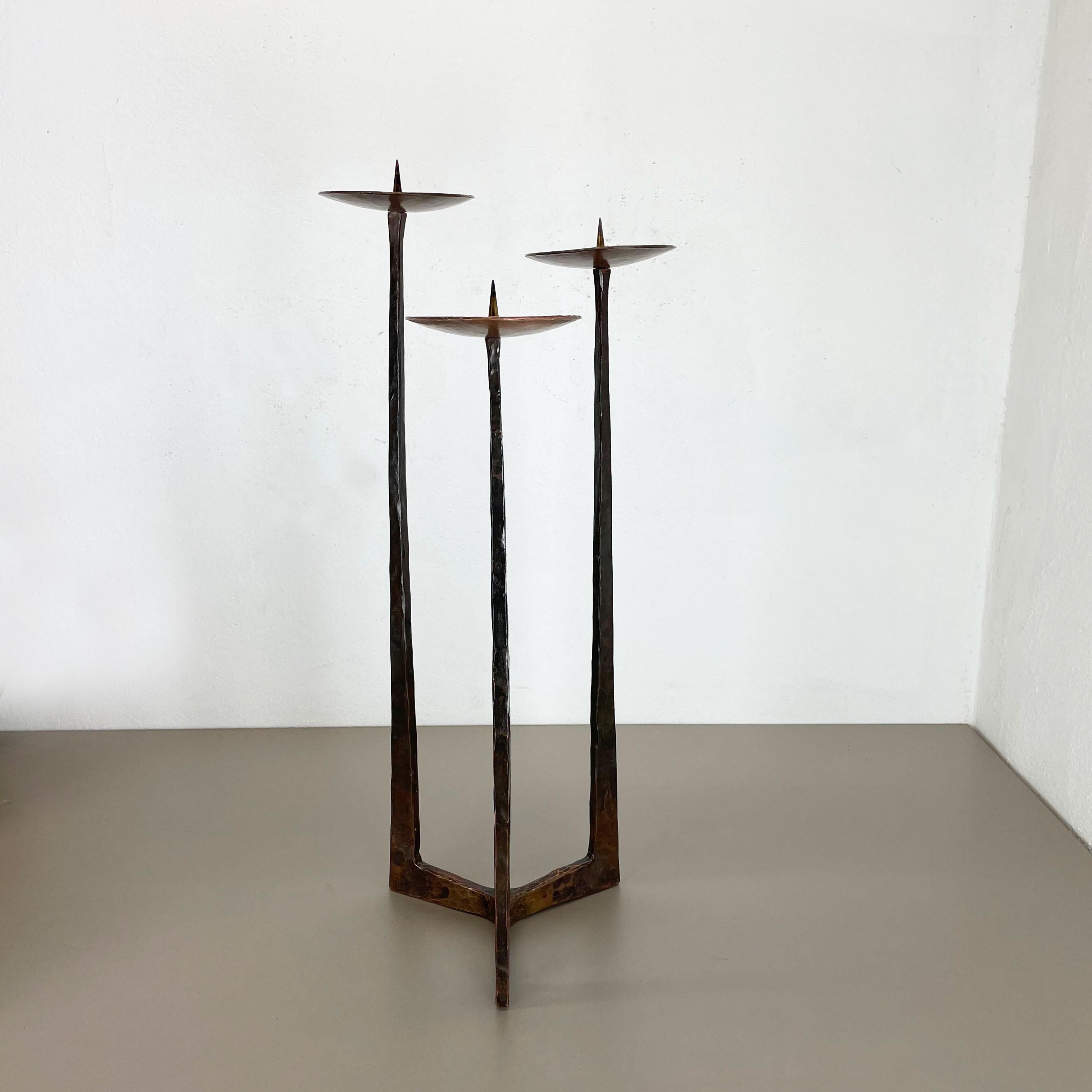 Article: Brutalist floor candleholder

Origin: Austria

Material: Solid copper candleholder stacking made of brass

Decade: 1950s

Description: This original vintage candleholder, was produced in the 1950s in Austria. it is made of solid