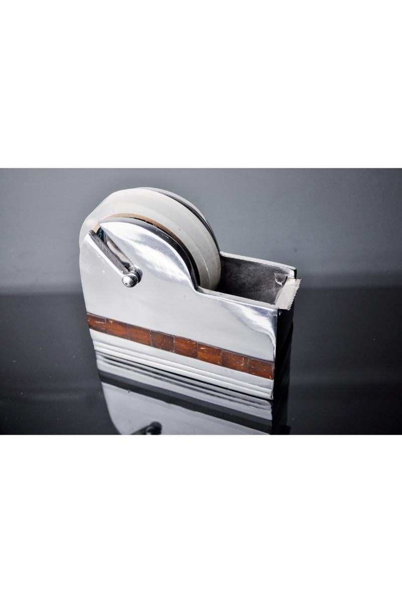 Superb and rare tape dispenser designed and manufactured in Italy in the 80s. Superb metalwork and stone inlay. Unique object due to its size that will bring a real design touch to your office. Very good condition and patina. Ref: 1498/1499.

