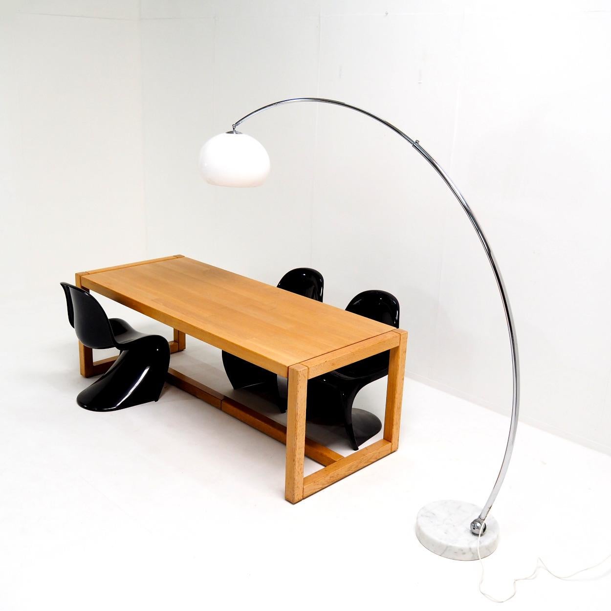 Very functional arc lamp from the 1960s or 70s.

This lamp is adjustable in many positions, so the lamp has multiple functionalities. Not only can you extend the length of the arm, but you can also adjust its angle. Illuminate a dining table easily