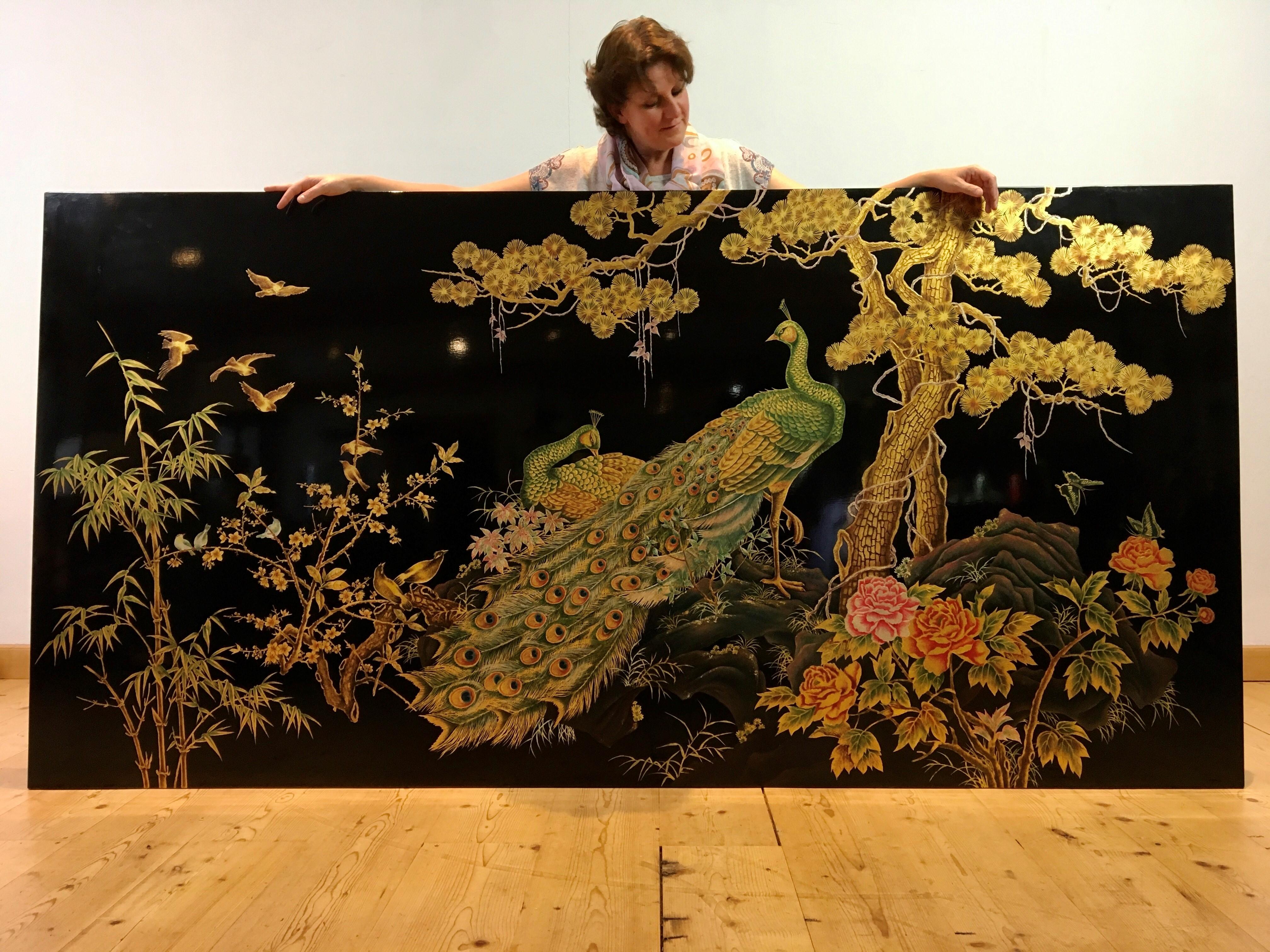 Stunning XL Asian wall panel with peacock and lots of birds.
A black shiny - black laquered panel with painted landscape with 2 peacock, birds, butterflies, flowers, bamboo plant, blossom trees etc ...
The use of goldpaint makes this art panel very