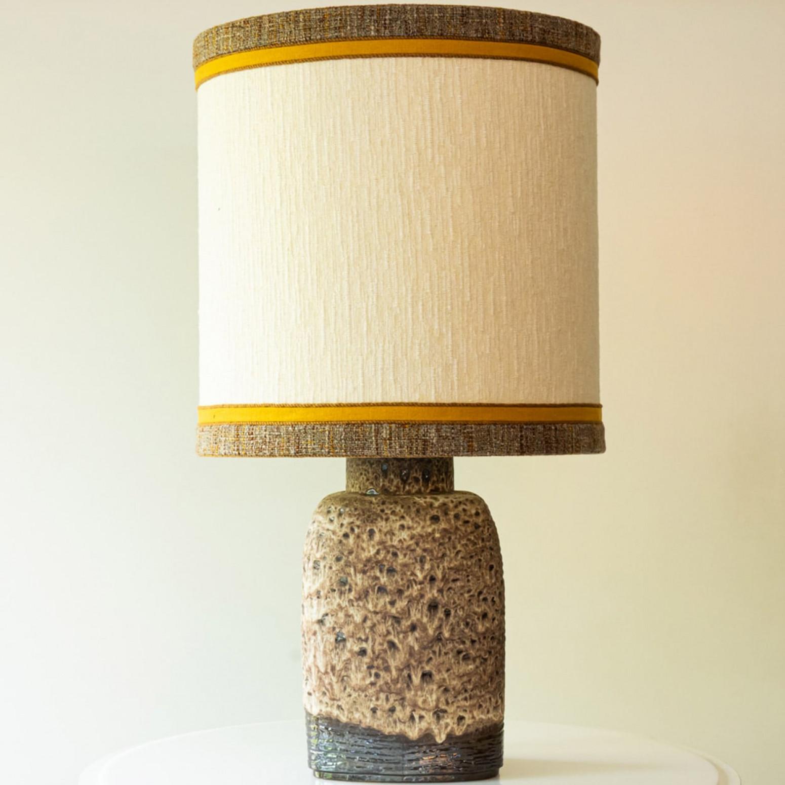 Beautiful XL ceramic table/floor  lamp, Denmark 1960s. Combined with a custom lampshade.

The base with brown tones and a dripping pattern fits perfectly with the custom made ocher silk lampshade with beige inner shade. The rich trimming is a