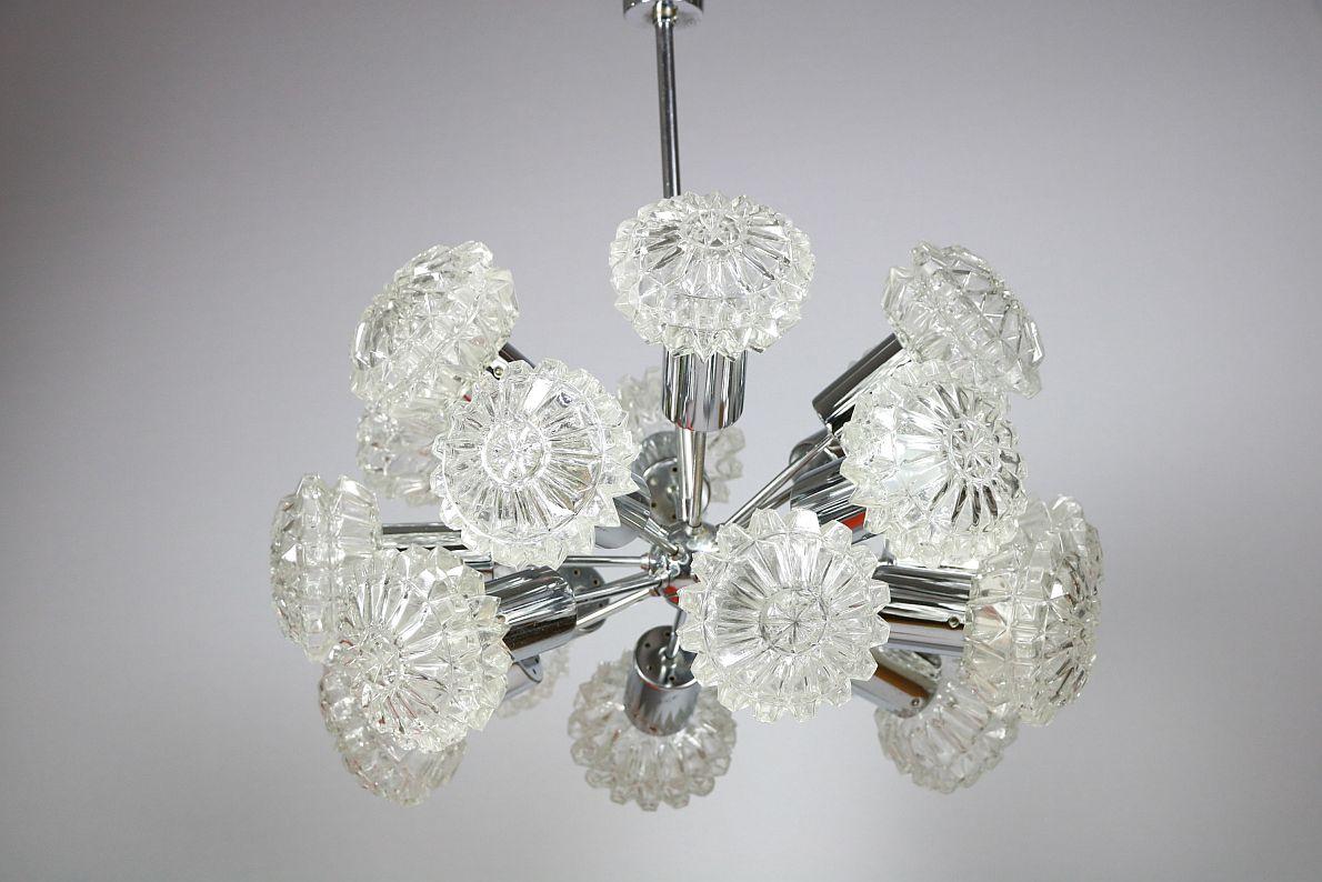Rare, gigantic Sputnik chandelier with 18 oval glass balls twisted onto a high-quality chrome frame.
 
Manufacturer: Richard Essig
 
The frame is like new, some of the balls have slight chipping on the ends. These are not visually noticeable, only