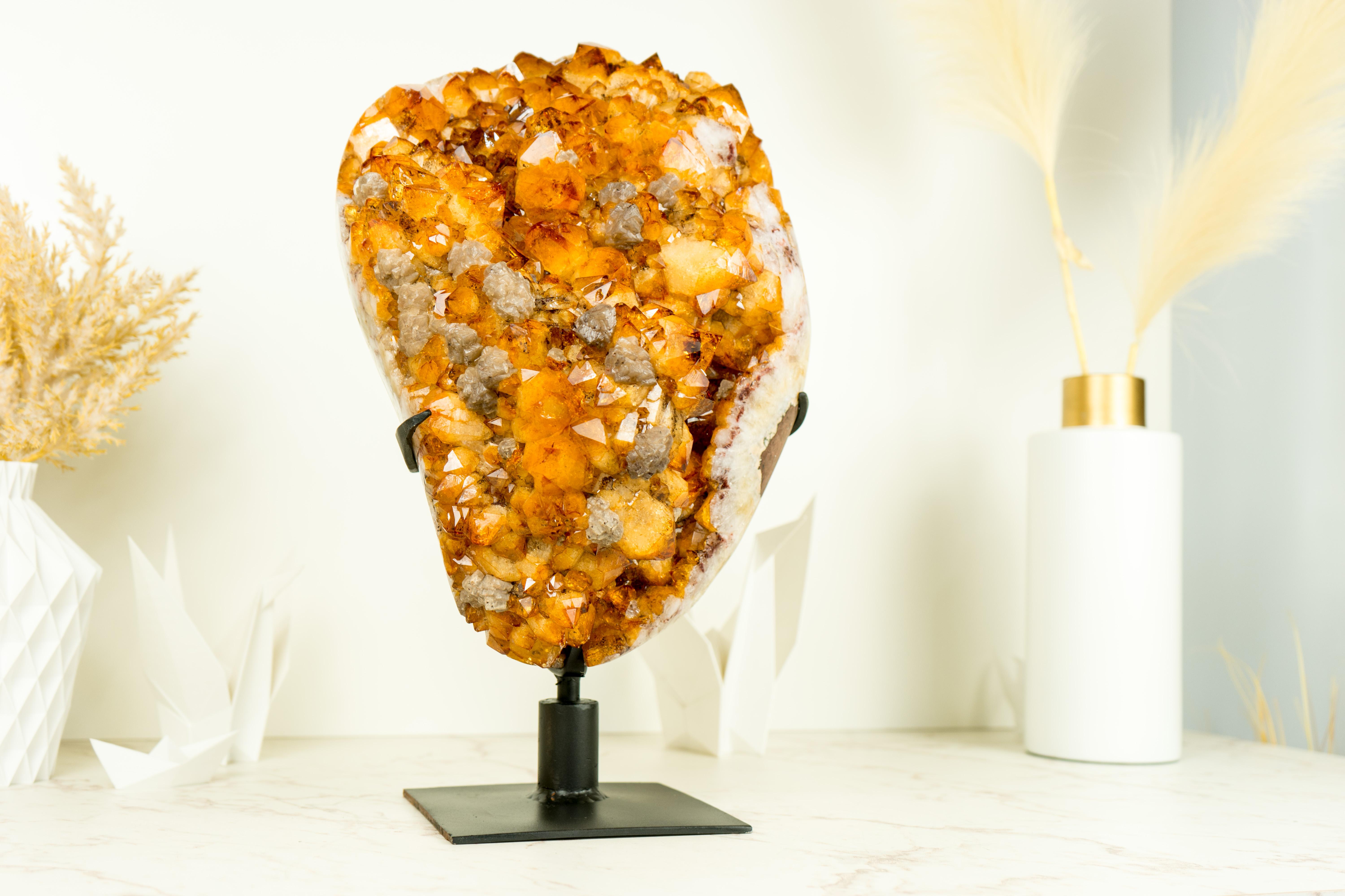 An exceptional specimen, this Citrine Geode showcases numerous special characteristics, such as its gallery-grade druzy points, stunning calcite flower, and captivating aesthetics. It is a natural artwork that you can add to your home decor or space