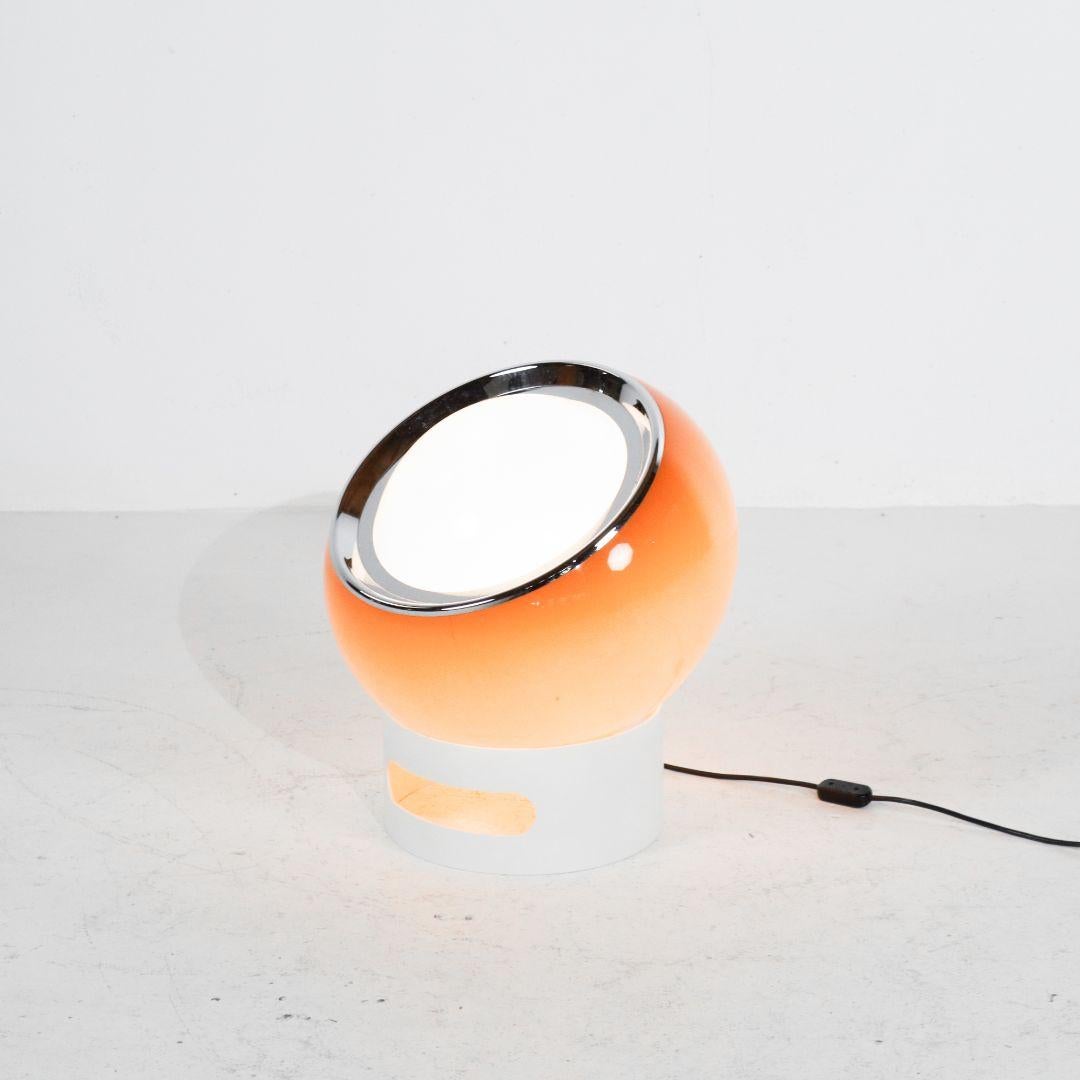 Very rare and large 'Clan' floor lamp by Studio 6G for Guzzini, Italy, 1968. The characteristic acrylic shade is movably mounted in a wide PVC ring. This allows the lamp to be aligned within a certain range. The light color is translucent orange