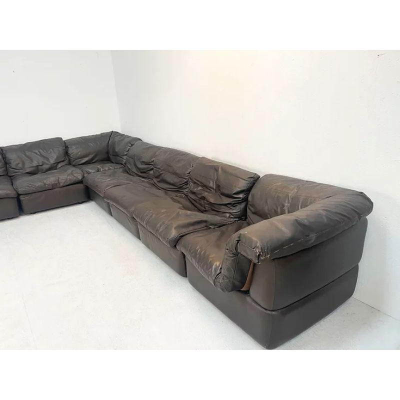 XL dark brown leather sofa set, 1970's.

This 1970's brown leather modular sofa set can be configured as shown or in sections around the room. The sofa is upholstered in a beautiful high qualtiy brown leather and is sturdy, solid, intact and