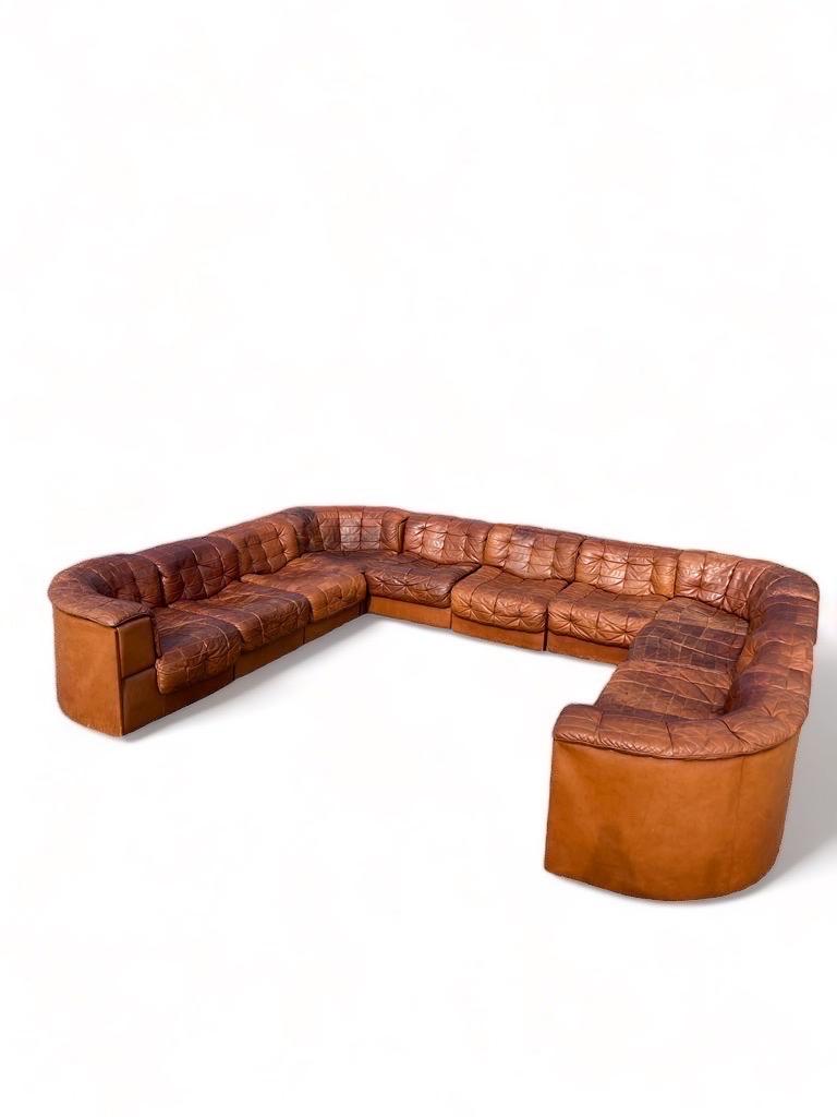 De Sede, sectional sofa, DS11 sofa, deep cognac patinated leather, 1970s.

This comfortable leather sofa is manufactured by De Sede in Switzerland. Sectional sofa by the Swiss quality manufacturer De Sede. This sofa consists of elven elements. The