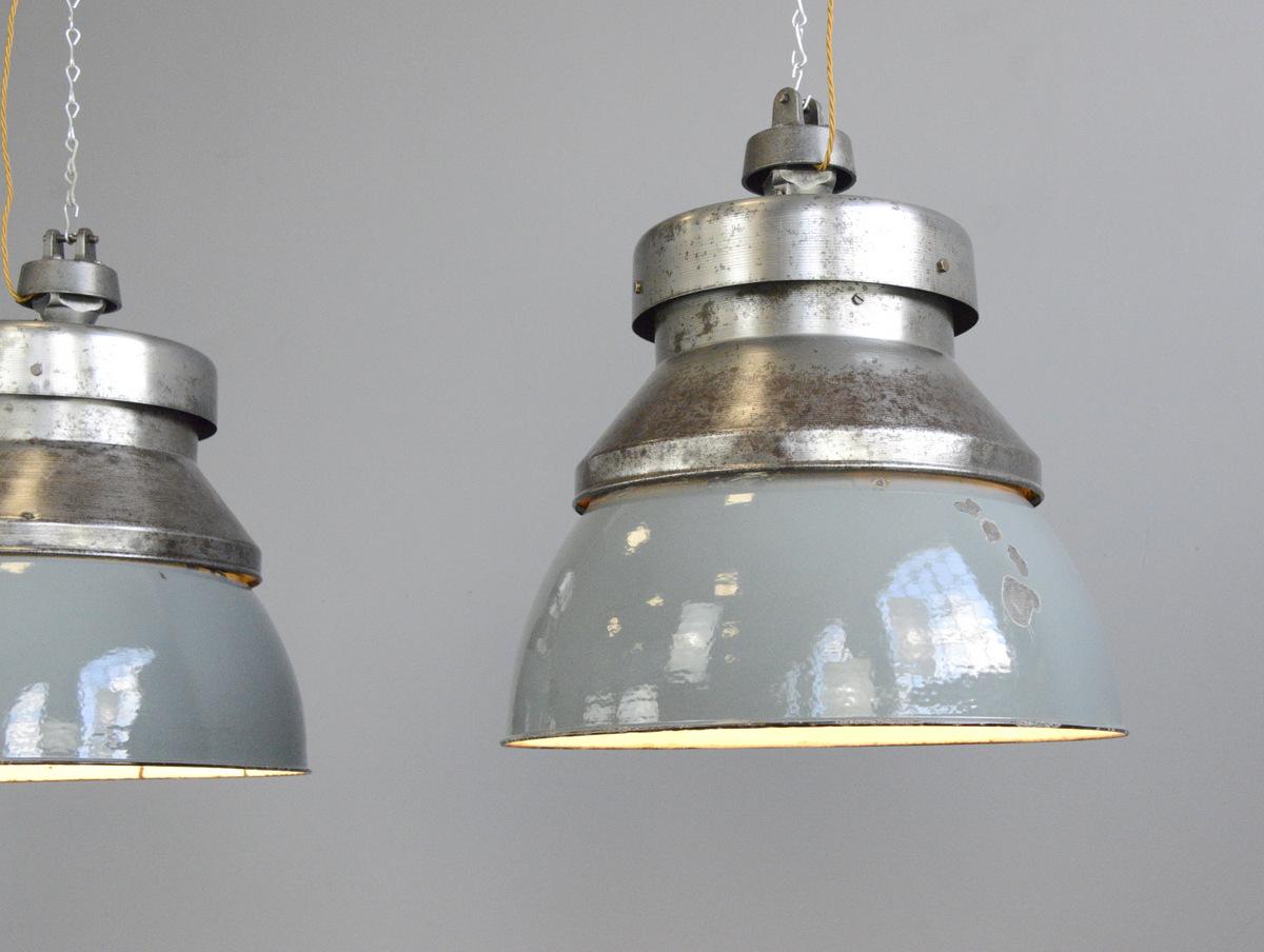 Extra large factory pendant lights by Kandem, circa 1930s

- Price is per light
- Vitreous grey enamel shades
- Shades twist off for easy cleaning
- Brushed steel tops with cast iron hanging
- Branded 