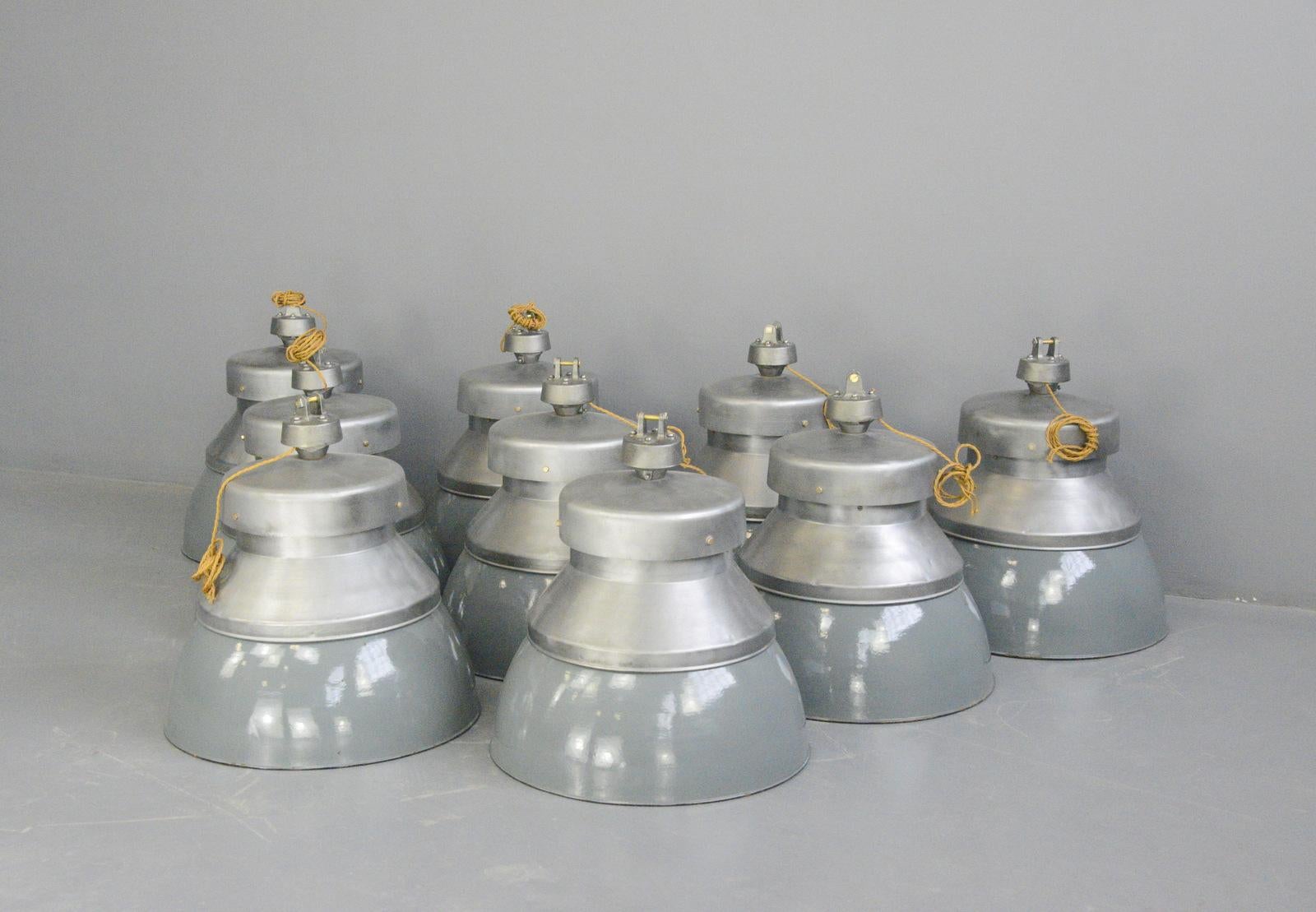 XL factory pendant lights by Kandem circa 1930s

- Price is per light (15 available)
- Vitreous grey enamel shades
- Shades twist off for easy cleaning
- Brushed steel tops with cast iron hanging
- Branded 