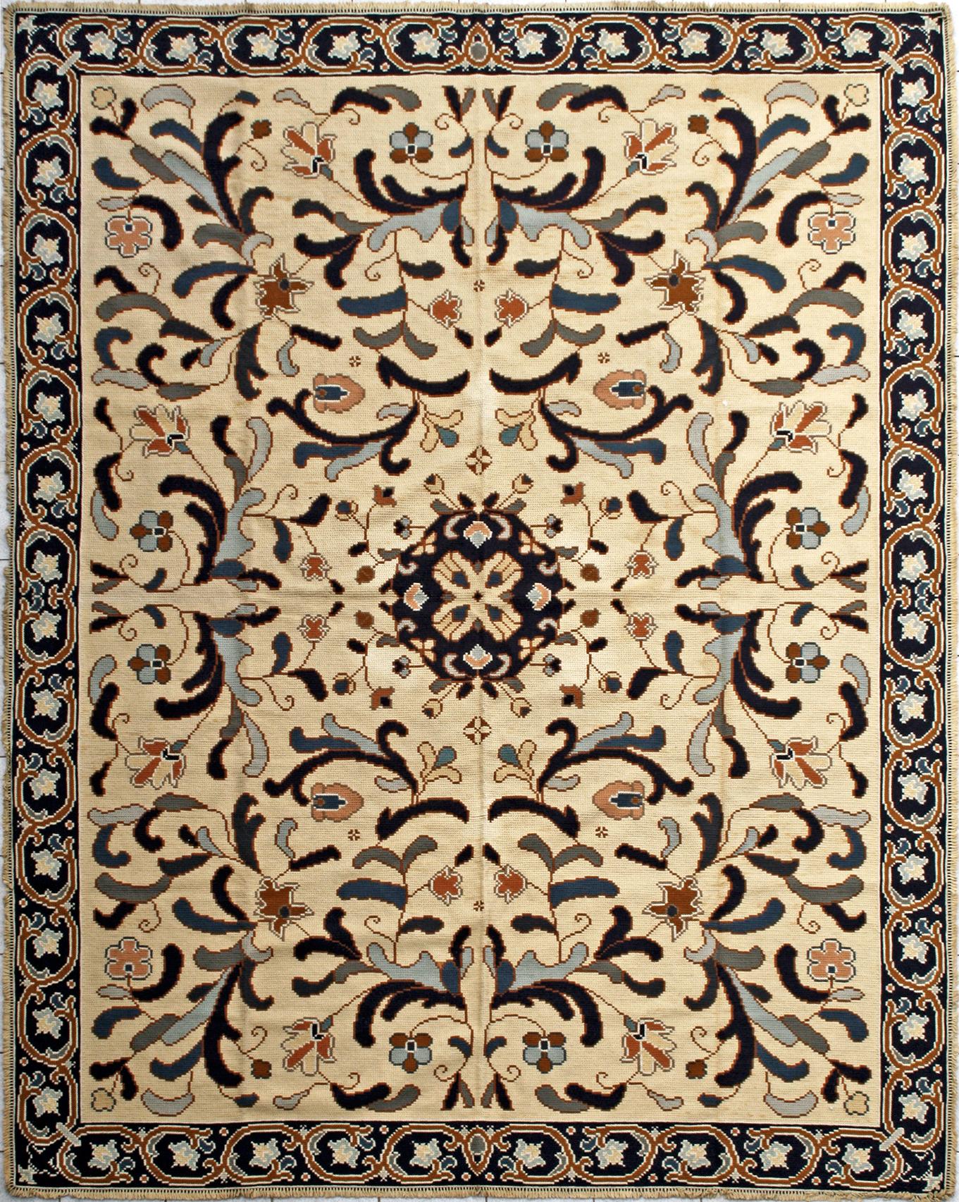 Beautiful Portuguese rug from Arraiolos, with a decorative design and light colors in cream and blue entirely hand embroidered with Portuguese needlepoint method, with wool on jute foundation. The work of two embroiderers is required for a full